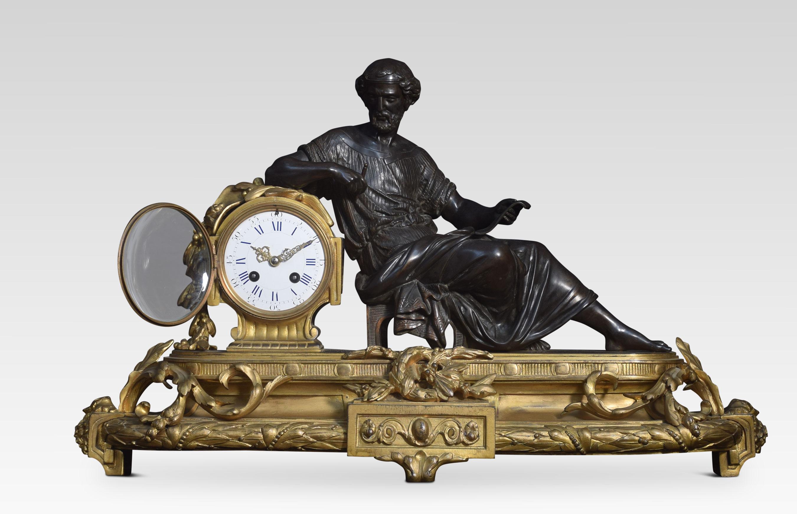 Late 19th-century French gilt metal mantel clock, surmounted with a classical figure, opposing a white enamel Roman numeral drum dial striking on a bell. Raised up on a plinth molded with foliate detail.
Dimensions:
Height 15 inches
Width 25