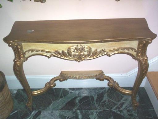Hand carved wood console with gilded and glazed finish.

  