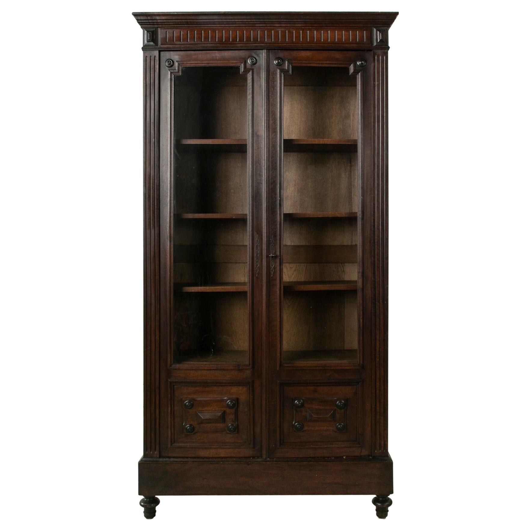 Late 19th Century French Henri II Walnut Bookcase with Hand Blown Glass Doors