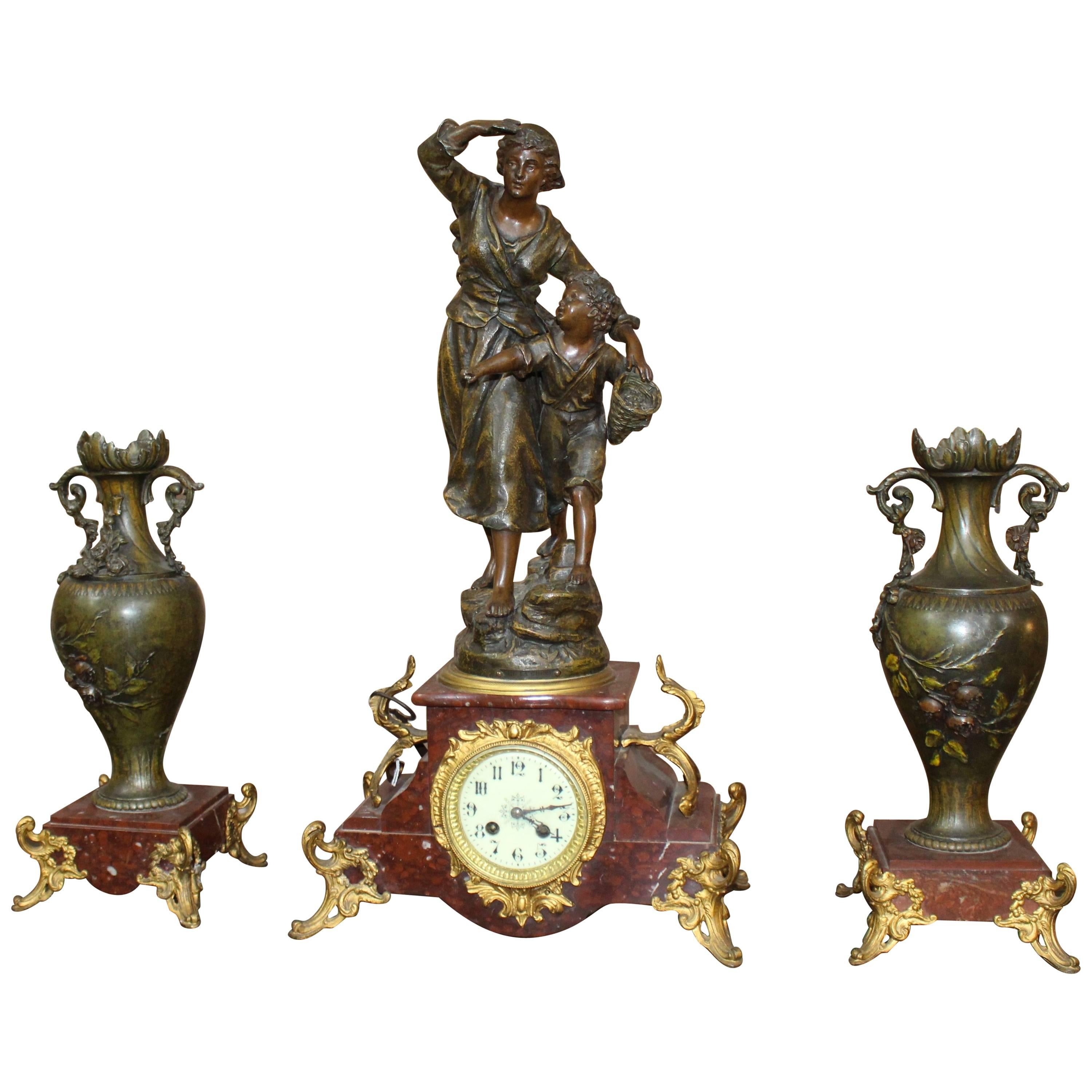 Late 19th Century French Imitation Bronze Spelter and Marble Clock Garniture Set
