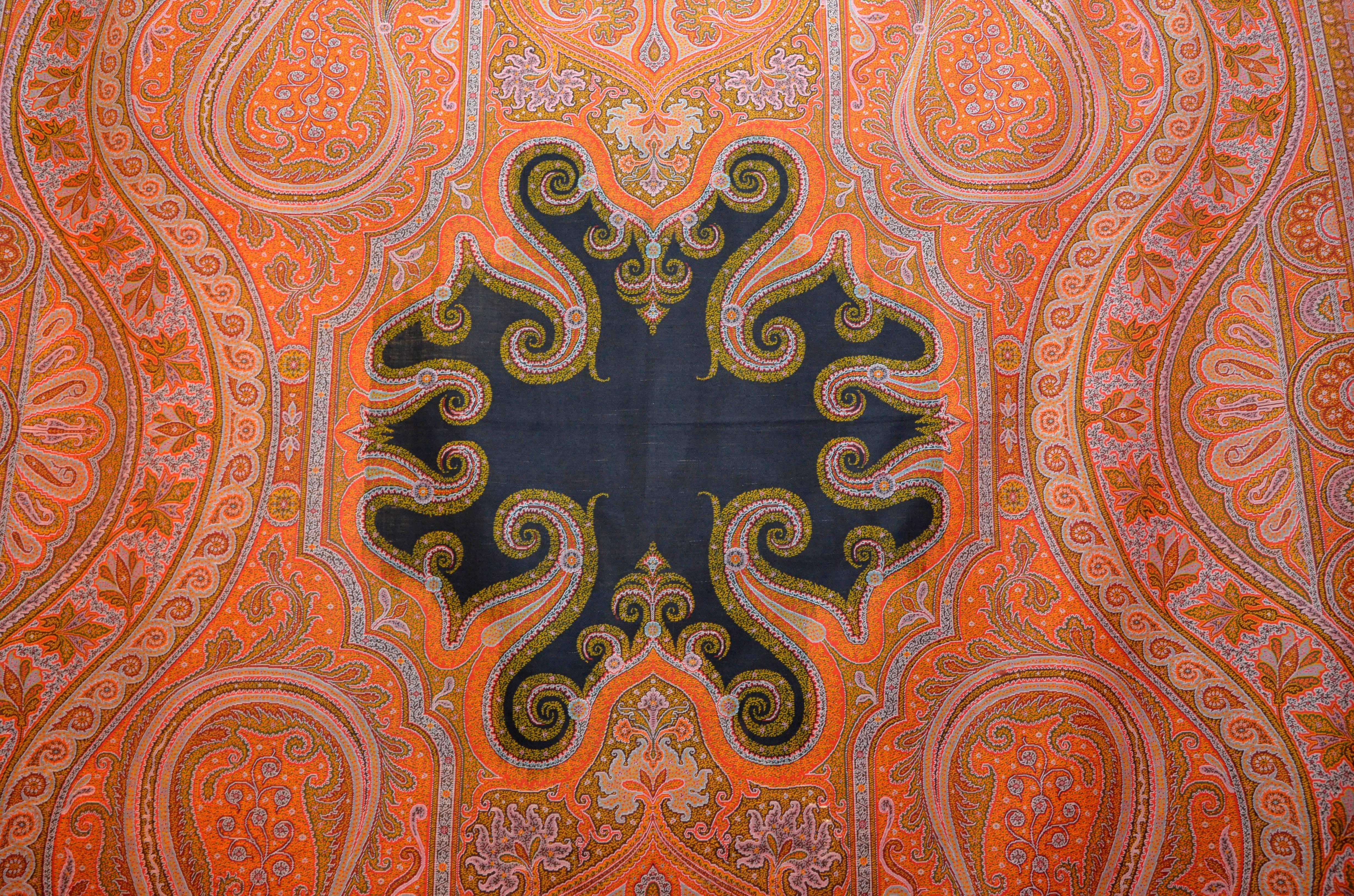 Kashmir Paisley Shawl, realized in France, circa 1870. Size 11.1 ft x 5.3 ft - cm: 339 x 161cm
Handwoven in wool, natural dying colors, with Jacquard hand loom.
Black silk and wool central reserve. Head bordures with niches inspired by Indian