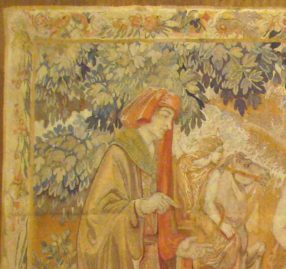 An antique, late 19th century French loomed tapestry, size 6'3 H x 10'3 W. This loomed tapestry features a scene with a hunting party in a forest setting, with the leader of the group at right standing with his hounds, his handler holding his horse