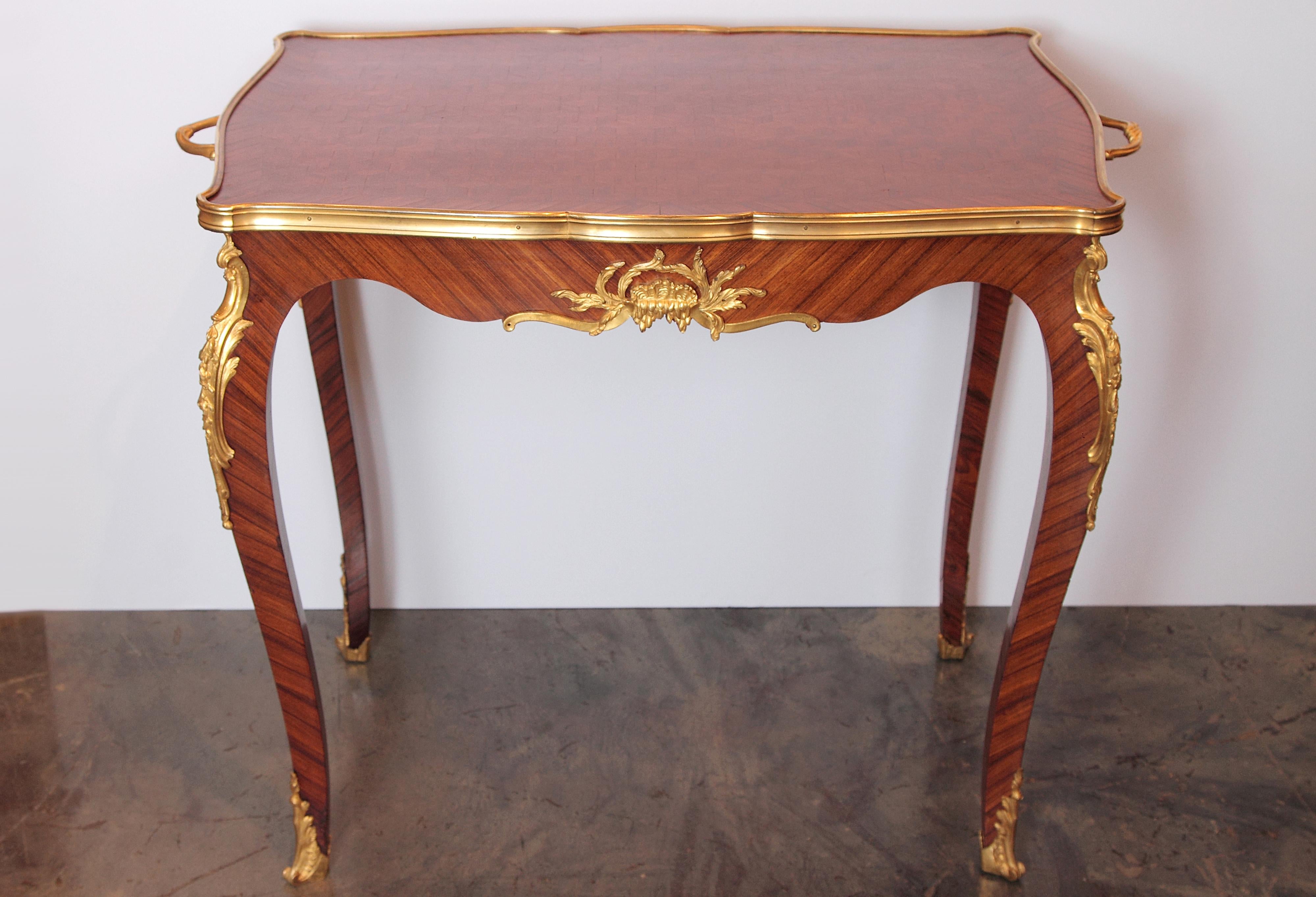 Late 19th century to turn of the 20th century French Louis XVI tray table. Kingwood and fine gilt bronze detail. Attributed to F. Linke .