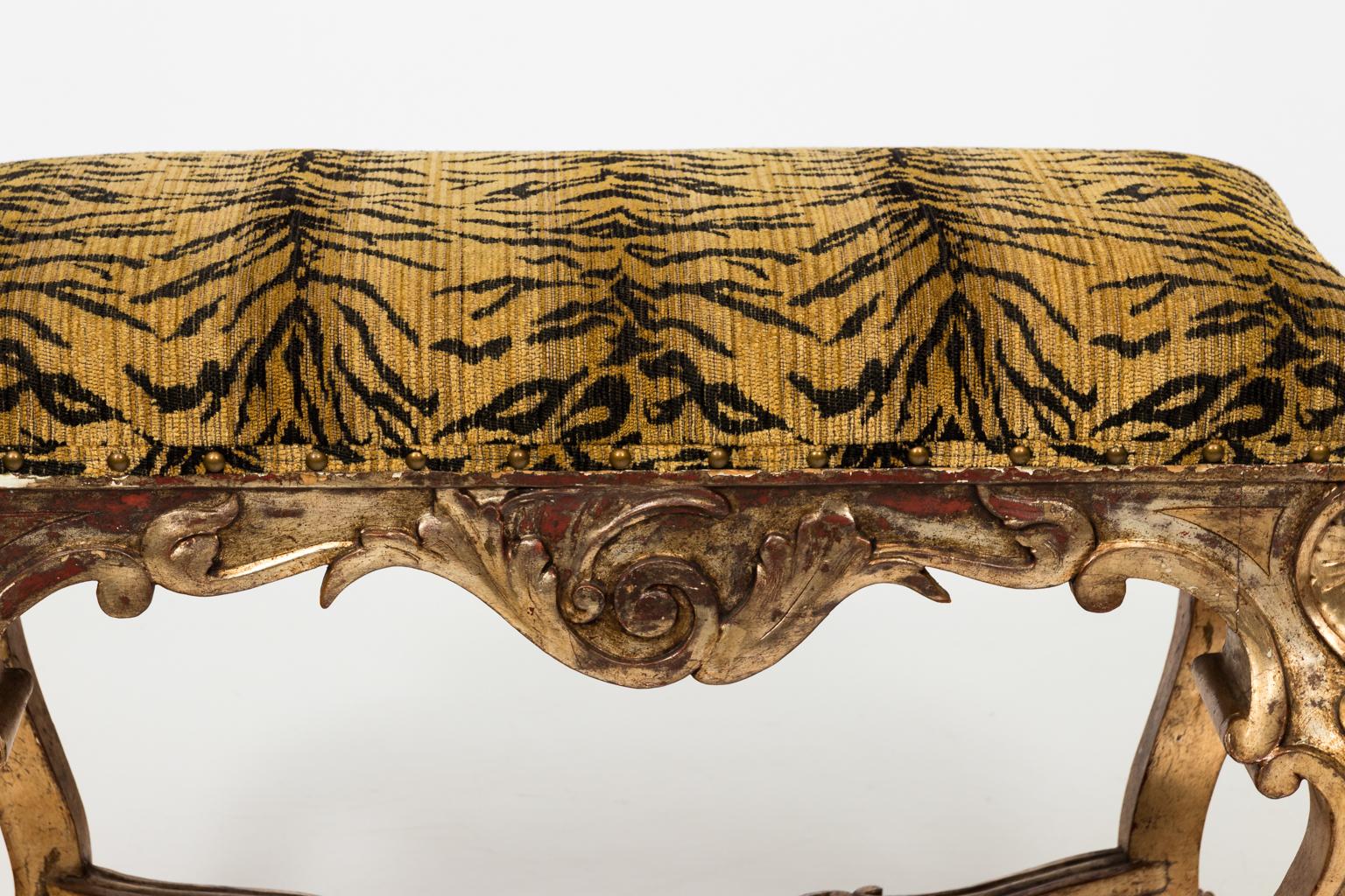 Late 19th century French Louis XV style stool with tiger print seat. Scroll-and-foliate carved apron, rising on cabriole legs carved with 