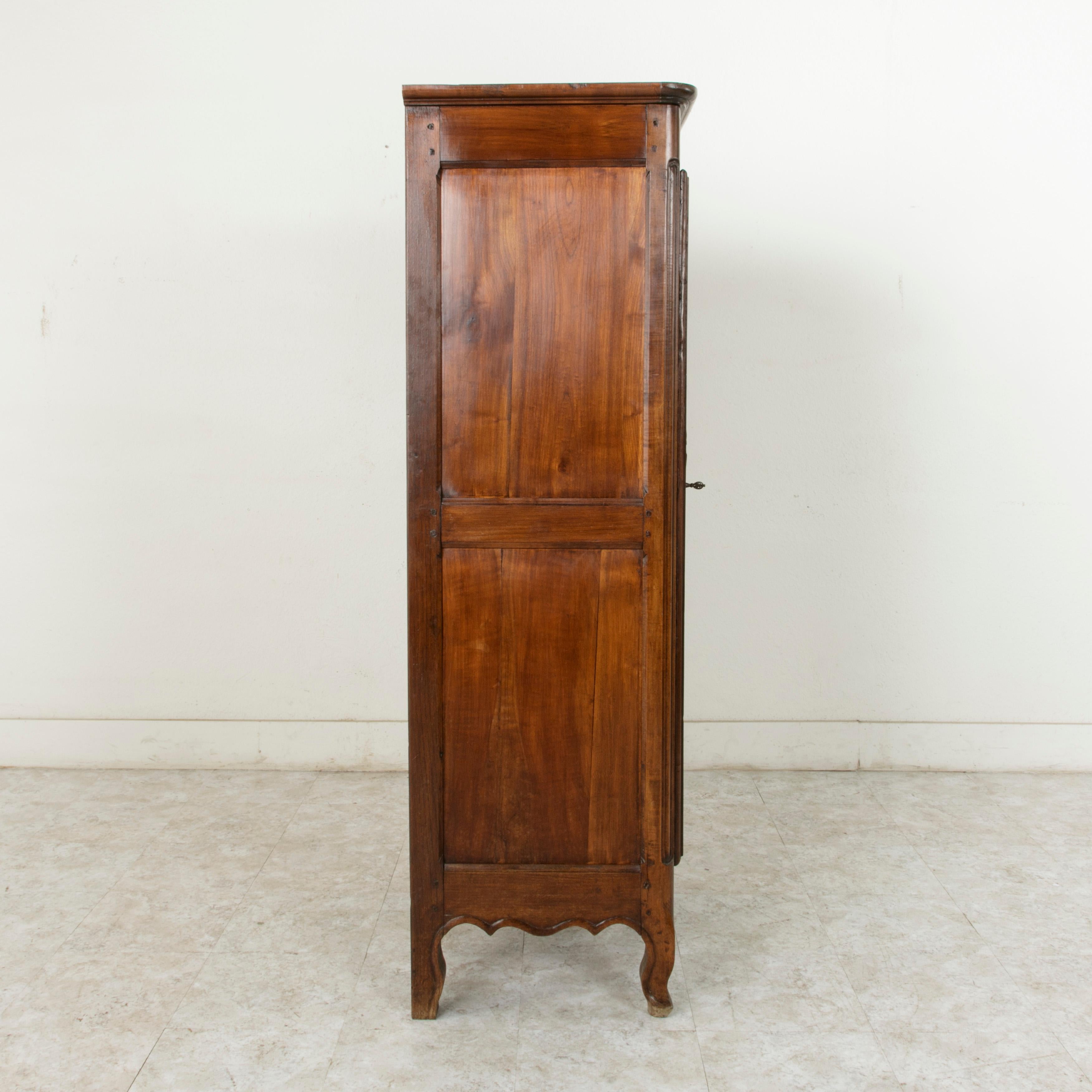 Hand-Carved Late 19th Century French Louis XV Style Hand Carved Walnut Bonnetiere Cabinet
