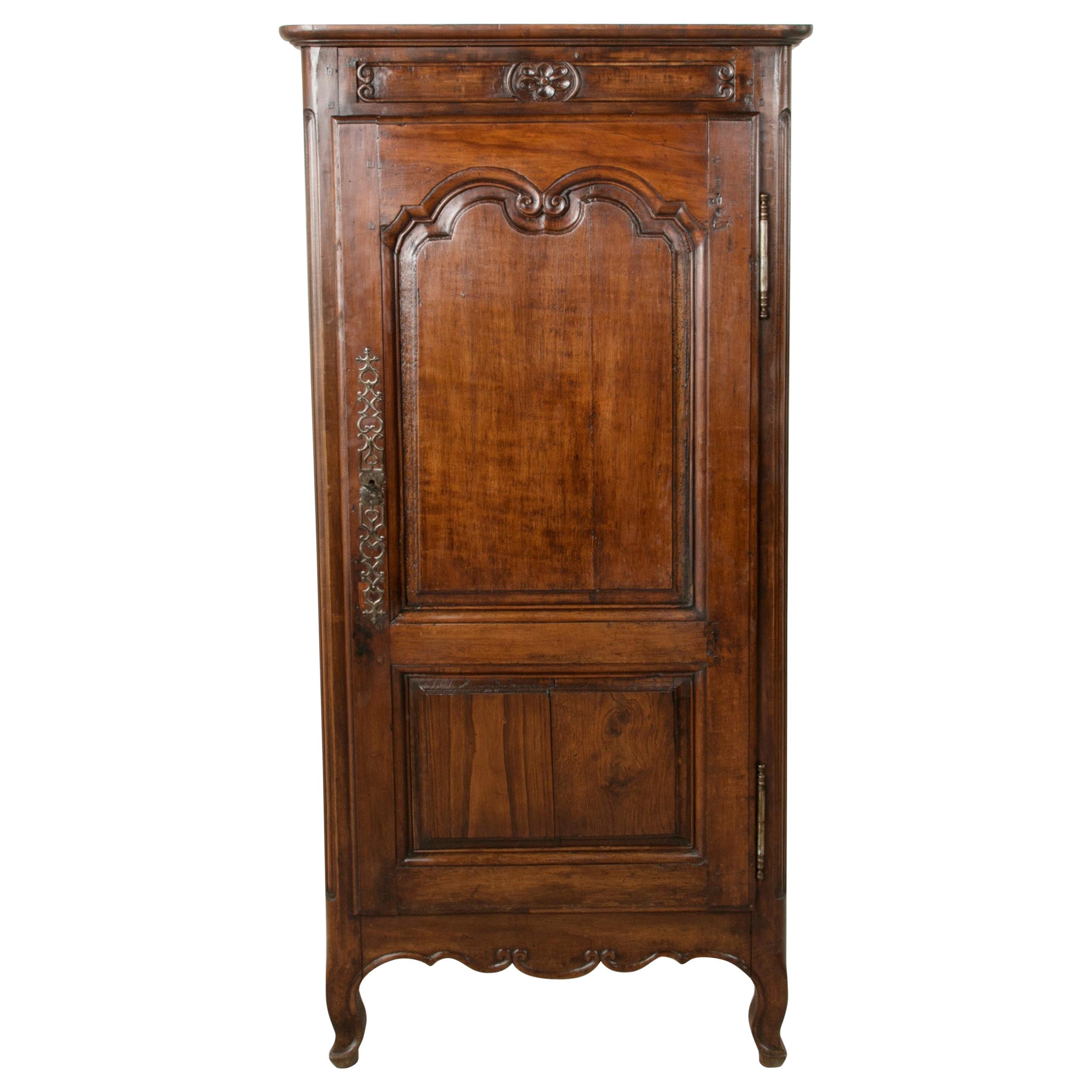 Late 19th Century French Louis XV Style Hand Carved Walnut Bonnetiere Cabinet
