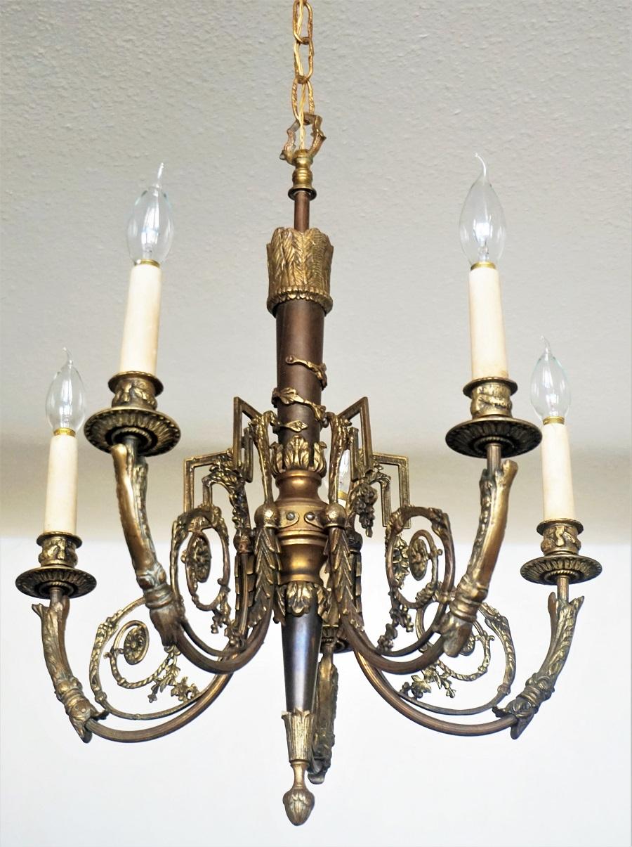 A fine Louis XVI style five-arm chandelier of gilt bronze and parcel patinated, extremely ornate with great details, France, 1880-1890.
This wonderful piece is in its original condition, no damages, great aged patina to bronze, rewired.
Five E14