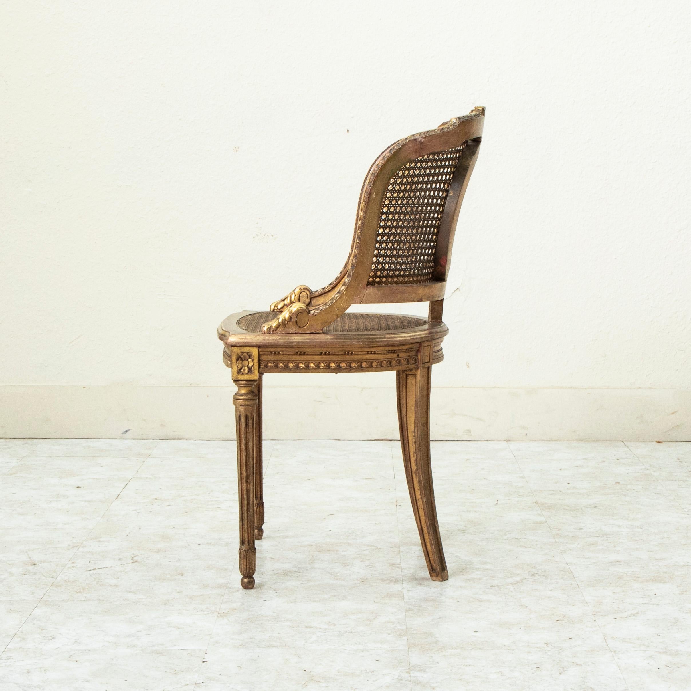 Late 19th Century French Louis XVI Style Gilt Wood Bergere Armchair with Caning In Good Condition In Fayetteville, AR