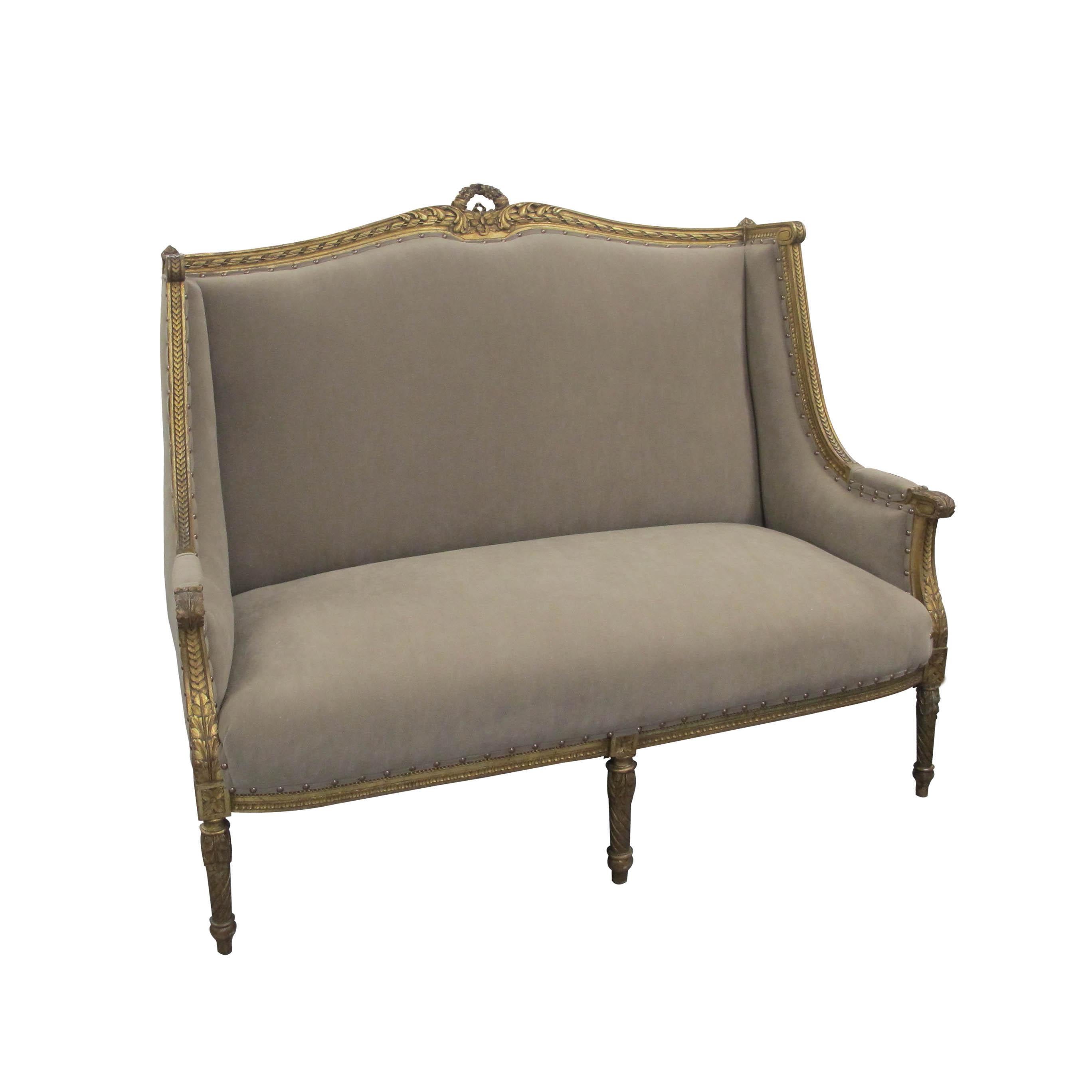 Louis the XVI style, high-backed two-seat French marquise sofa, circa 1880. Recently reupholstered in a Suede like Impala fabric, in a light brown color, which is easy to clean and very resistant. Feature antiqued studs secure the fabric in place to