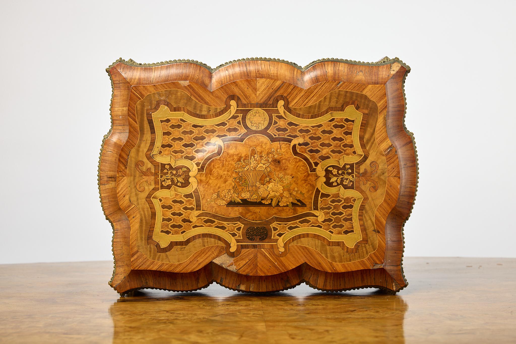 A beautifully detailed French, brass mounted, marquetry and inlaid burl, fruitwood, and kingwood dresser box. The top is domed and the interior lined with original velvet. Bass banding on the exterior and brass lock plate marked Maison