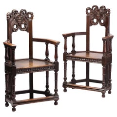 Late 19th Century French Oak Caquetoire Grotesque Pan Carved Armchairs 