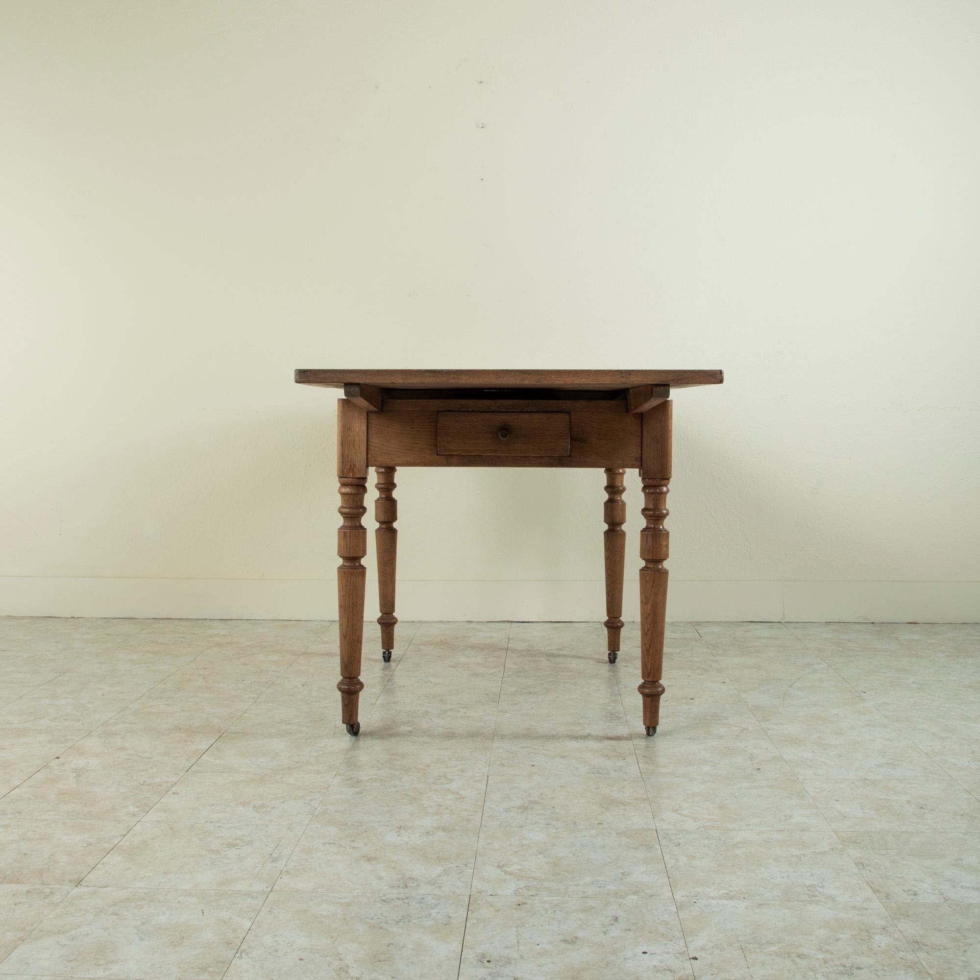 Late 19th Century French Oak Farm Table on Casters with Extendable Leaves 7