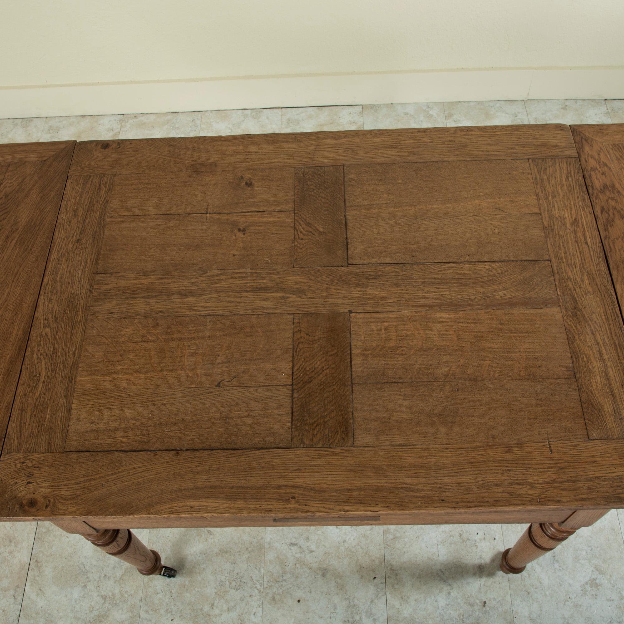 Late 19th Century French Oak Farm Table on Casters with Extendable Leaves 9