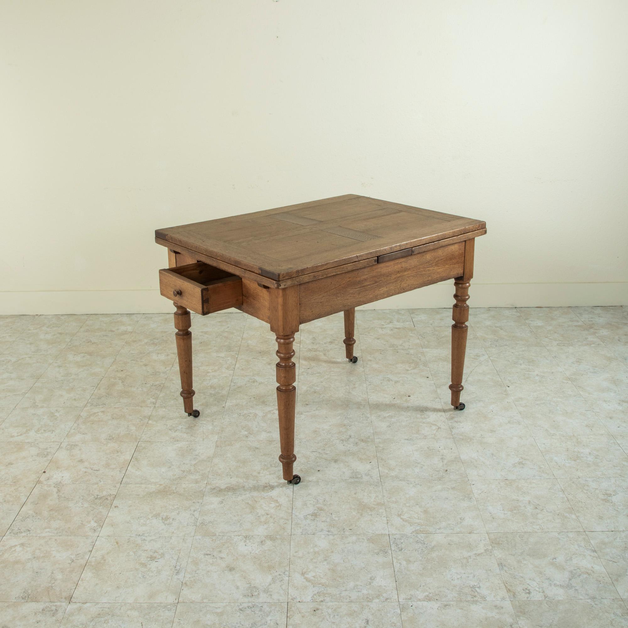 Late 19th Century French Oak Farm Table on Casters with Extendable Leaves 16