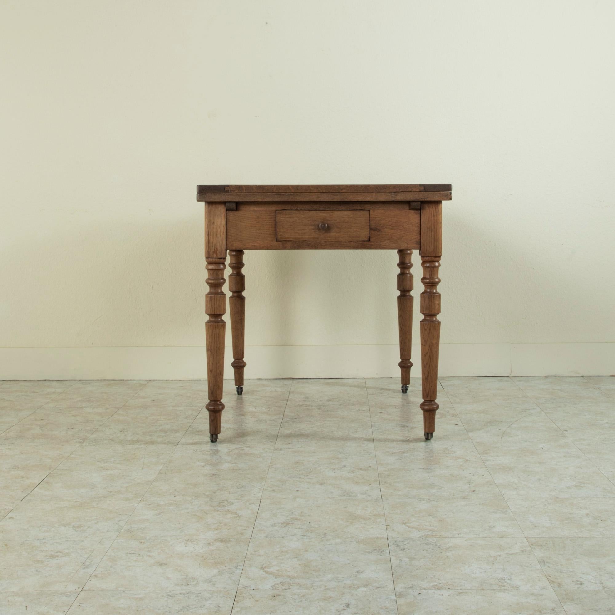 Late 19th Century French Oak Farm Table on Casters with Extendable Leaves 3