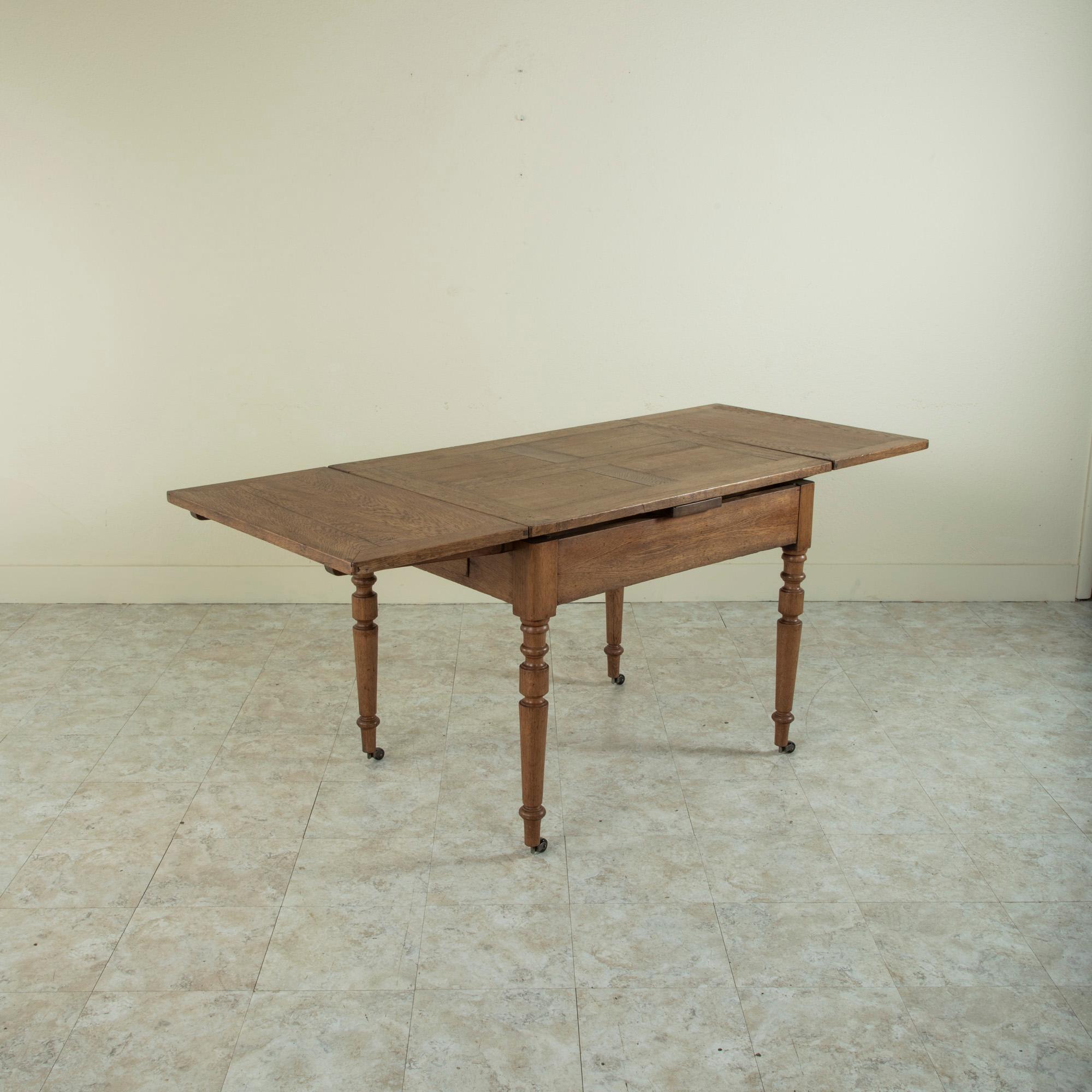 Late 19th Century French Oak Farm Table on Casters with Extendable Leaves 4