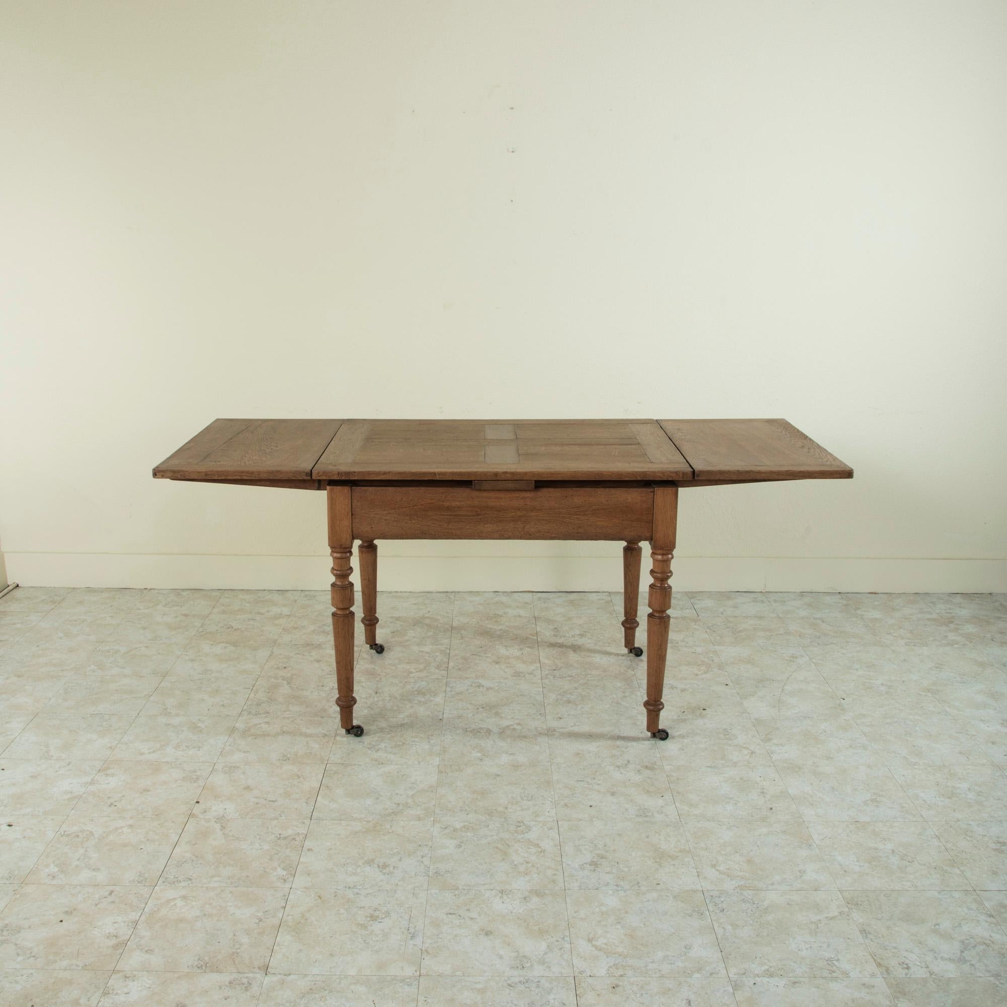 Late 19th Century French Oak Farm Table on Casters with Extendable Leaves 5