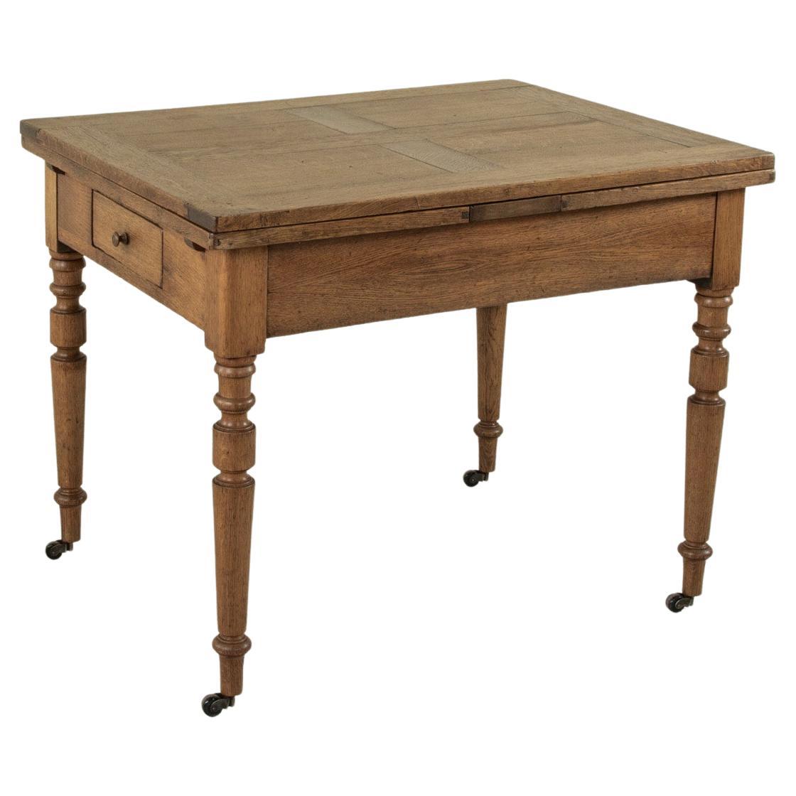 Late 19th Century French Oak Farm Table on Casters with Extendable Leaves