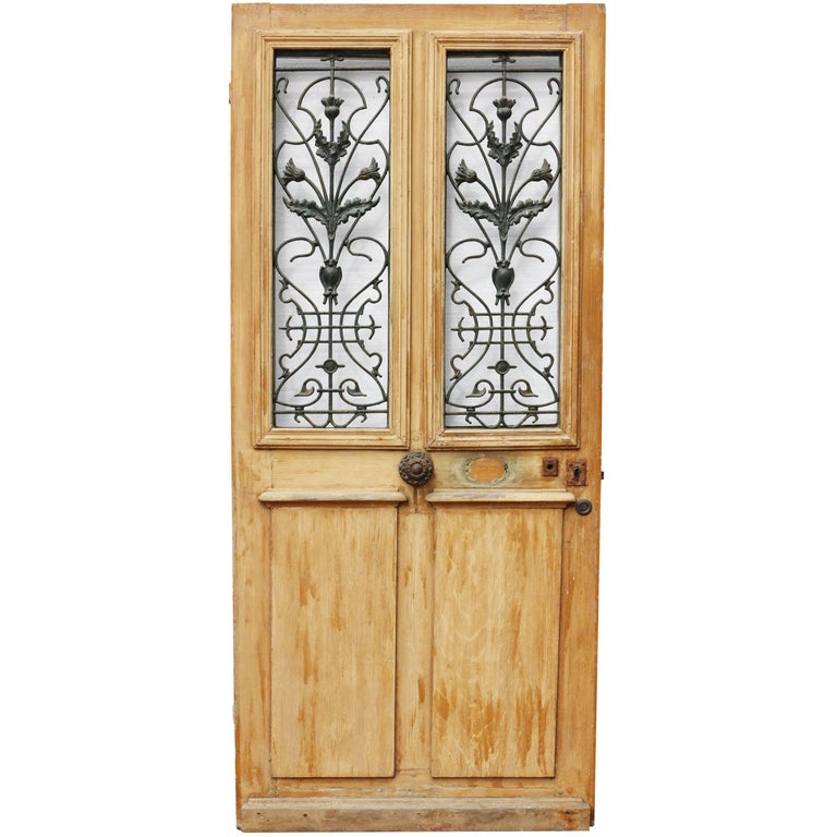 Late 19th Century French Painted Pine Front Door With Cast Iron Late 19th Century French Painted Pine Front Door With Cast Iron Grills For