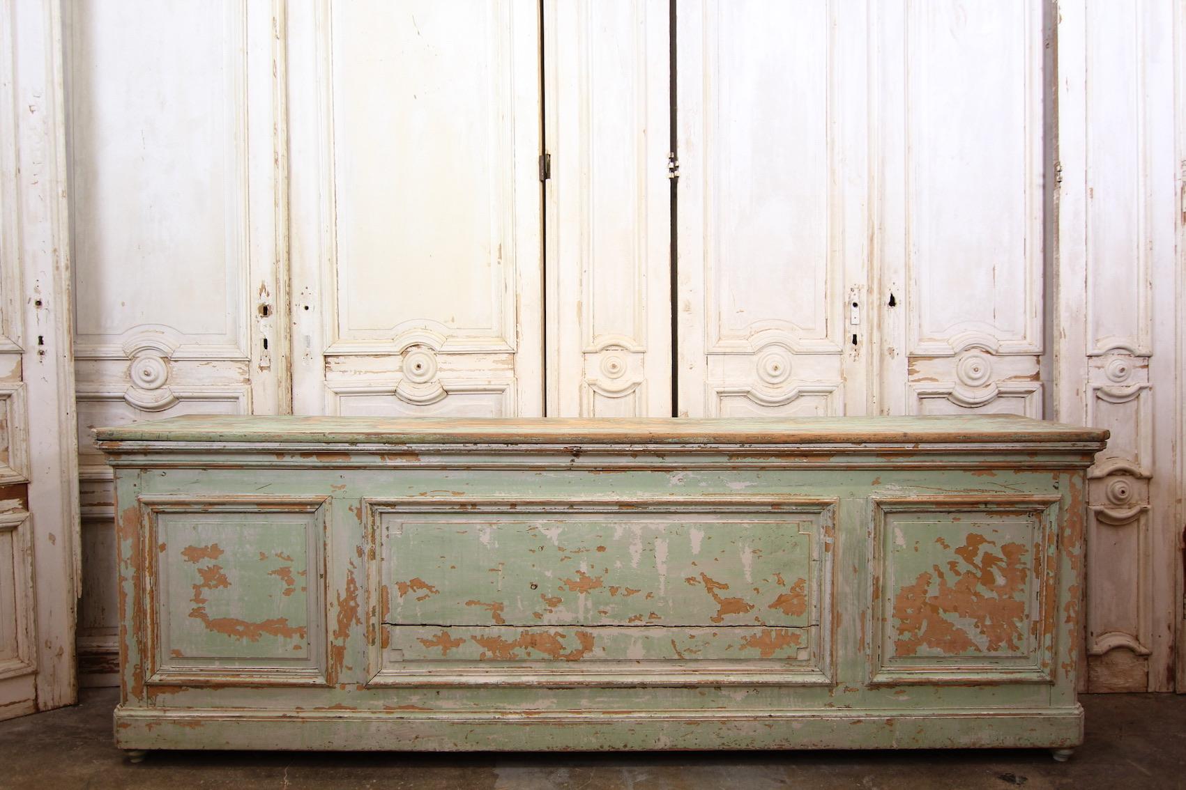 Large French shop counter with original patina from the late 19th century.

Dimensions: 
88.5 cm high / 34.8 inch high,
263 cm wide / 103.5 inch wide,
55 cm deep / 21.7 inch deep.
 