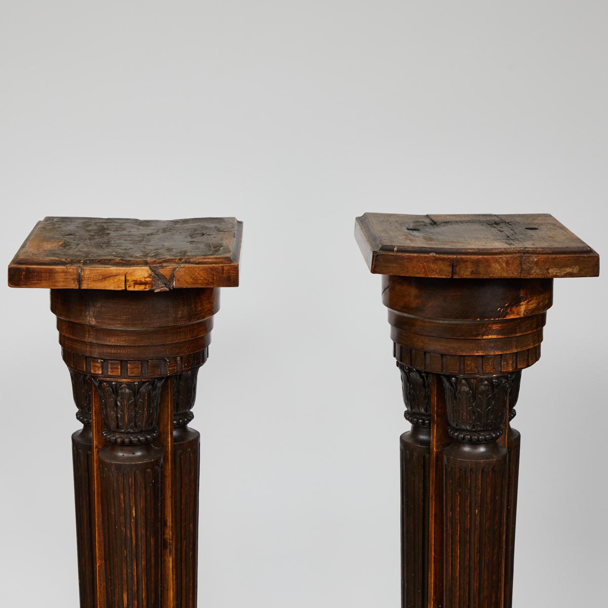 Late 19th century French pair of classical pedestal stand plinths. They feature carved corinthian columns.
