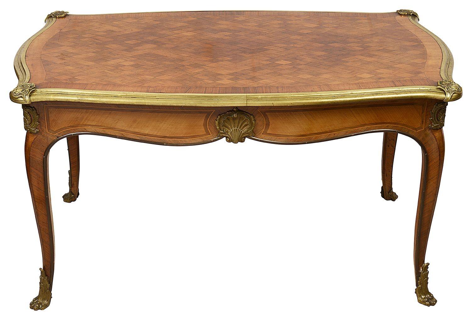 A good quality French late 19th century parquetry inlaid Kingwood side / coffee table, having gilded ormolu moldings, raised on elegant cabriole legs.