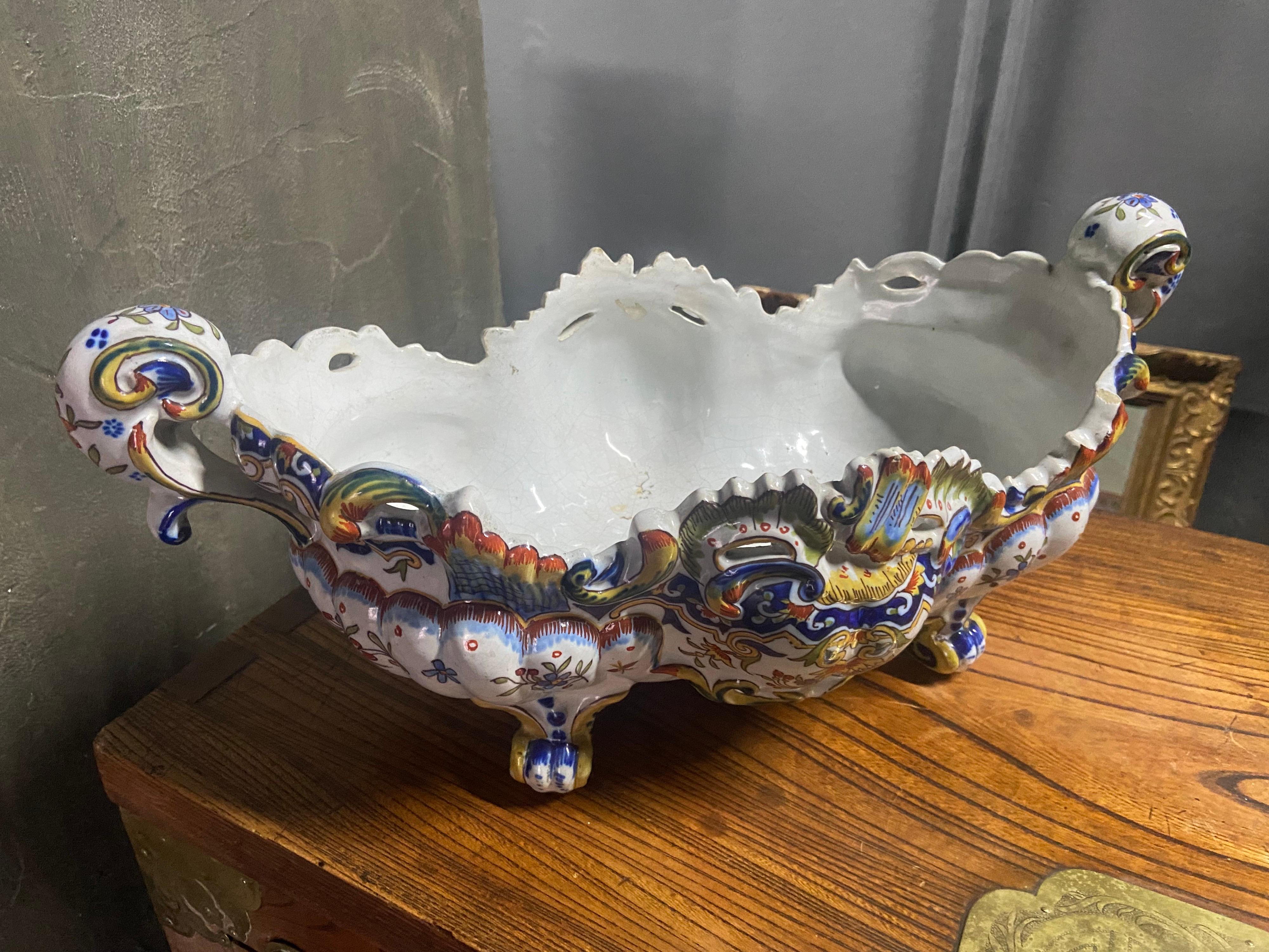 French Desvres faience jardinière cache pot painted with flowers with rich ornamentation. Could be a beautiful centrepiece for your table.
Very good condition signed on the bottom.
France, circa 1900.