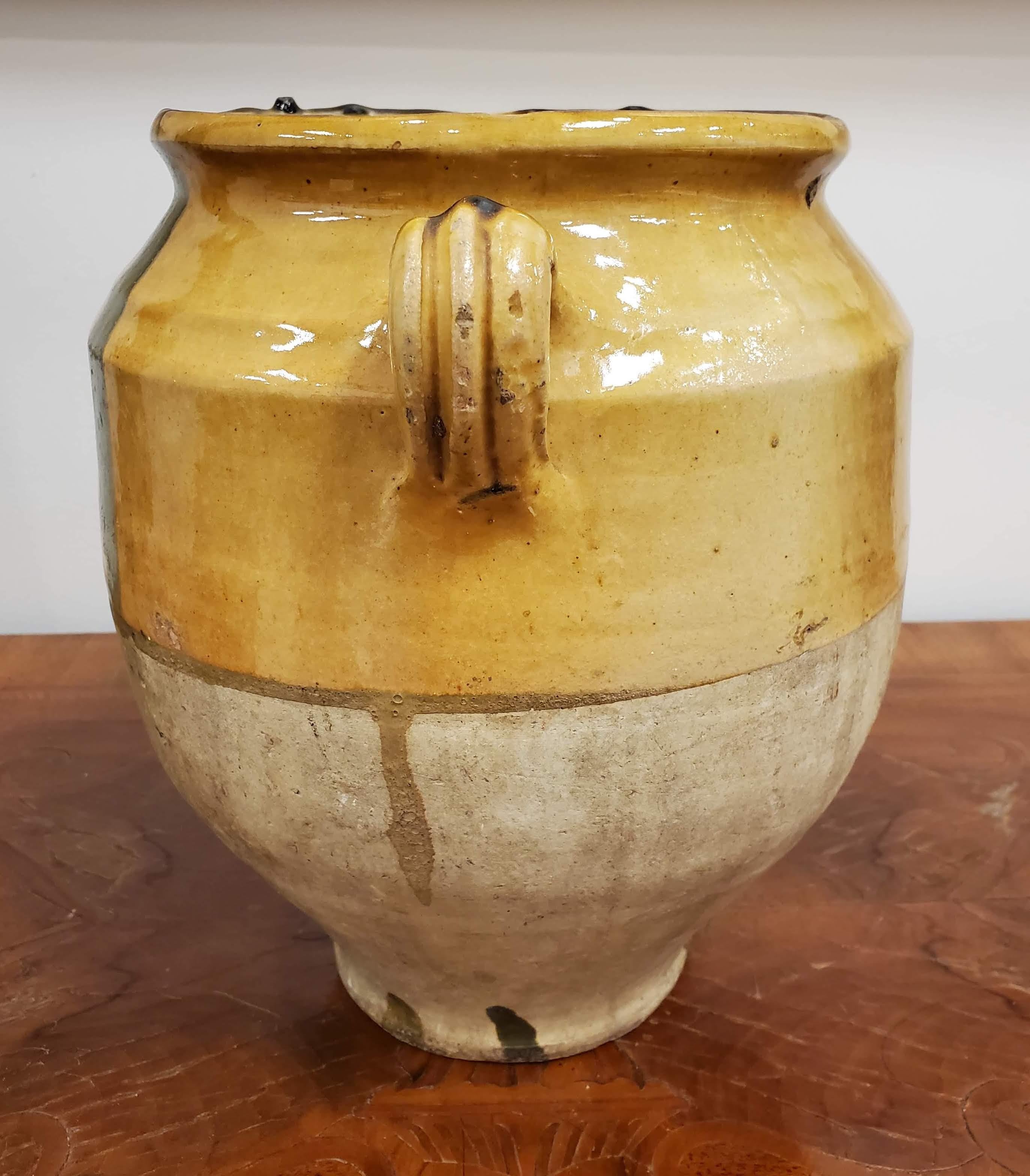 French Provincial terra cotta “Confit” Pot. Yellow glazed. Once a staple in French kitchens, confit pots were popular to preserve and cook duck before refrigeration existed. They are also the featured vase in Van Gogh's Sunflower series. 
Southern
