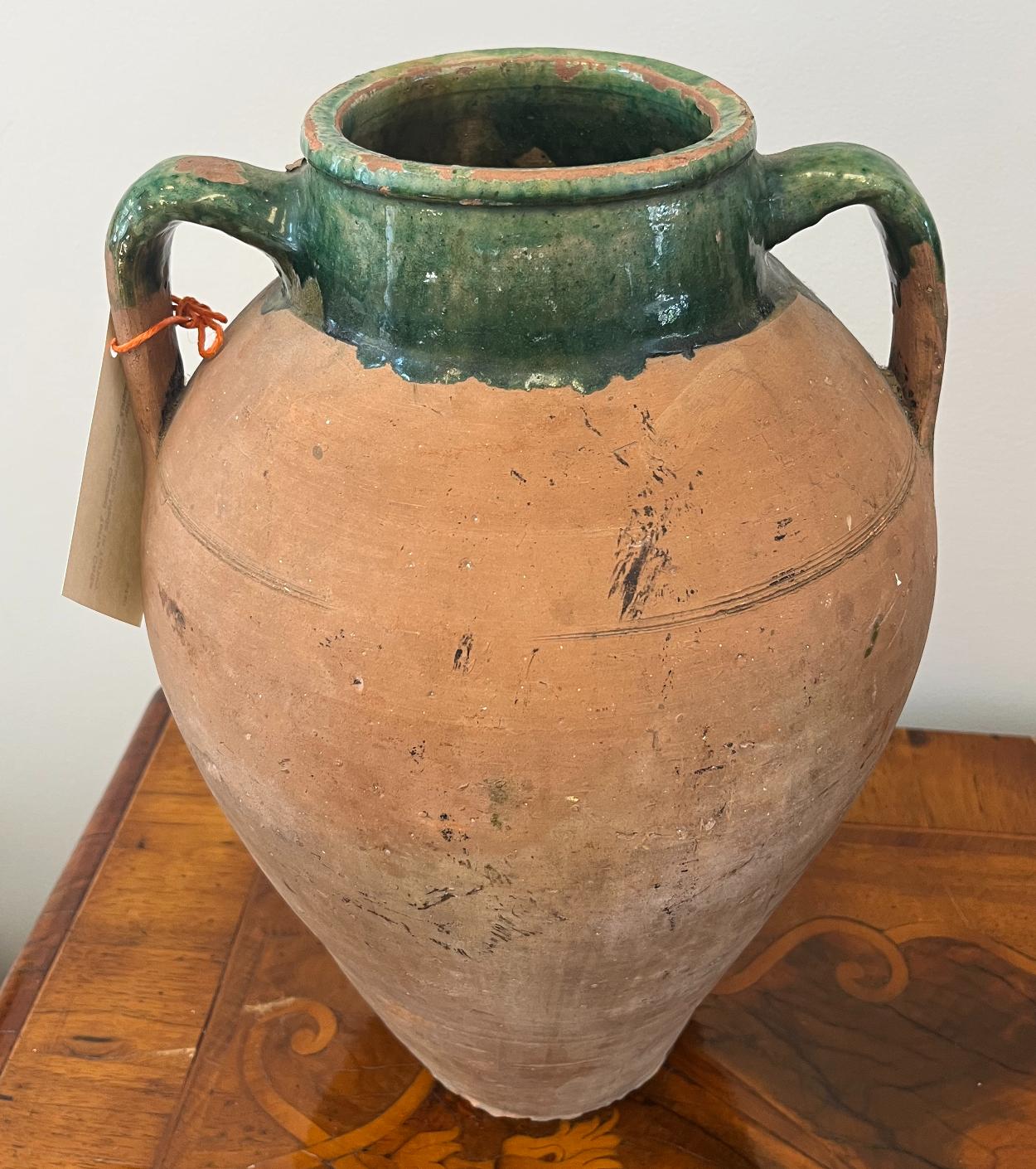 19th century green glazed Terra Cotta tall pot with two handles 
Turkey, circa 1880. 
Measures: 15” High 10” Diameter.

