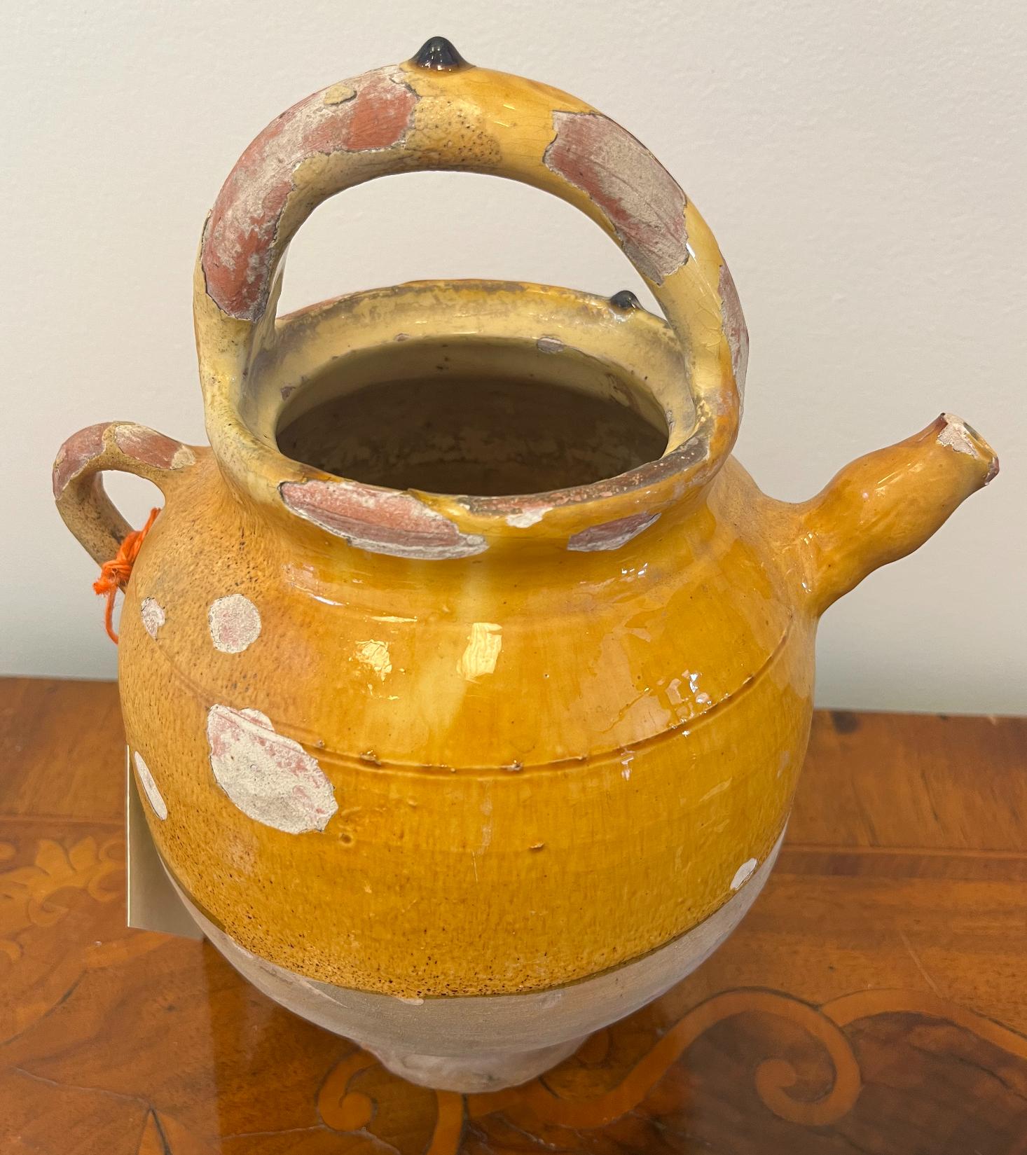 19th Century French Provincial terra cotta wine jug. 
Provence, circa 1880
Measures: 10.5” H, 7” D.
 