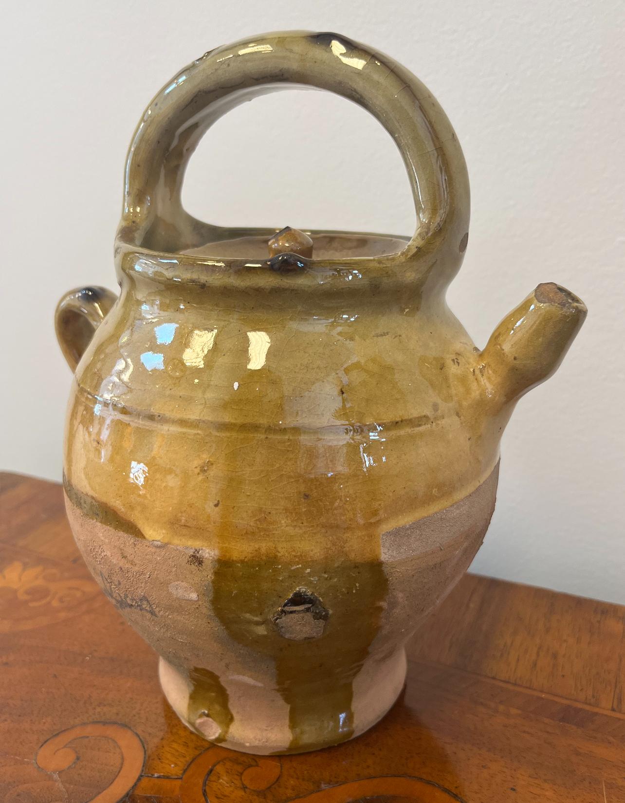 19th Century French Provincial Terra Cotta Wine Jug. 
Provence, circa 1880
Measures: 9.5” H, 6” D.
 