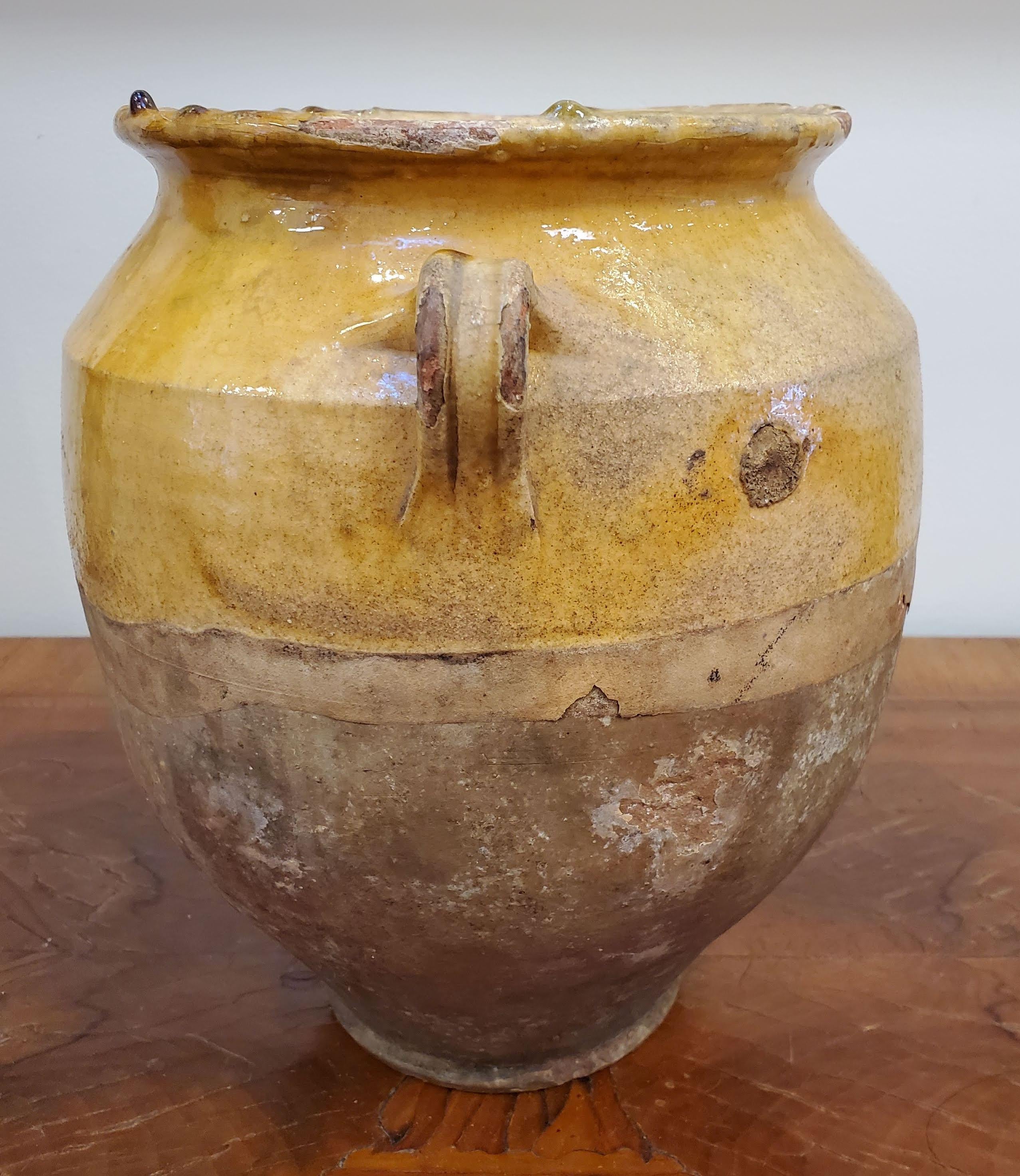 French Provincial Terra Cotta “Confit” Pot. Yellow glazed. Once a staple in French kitchens, confit pots were popular to preserve and cook duck before refrigeration existed. They are also the featured vase in Van Gogh's Sunflower series. 
Southern