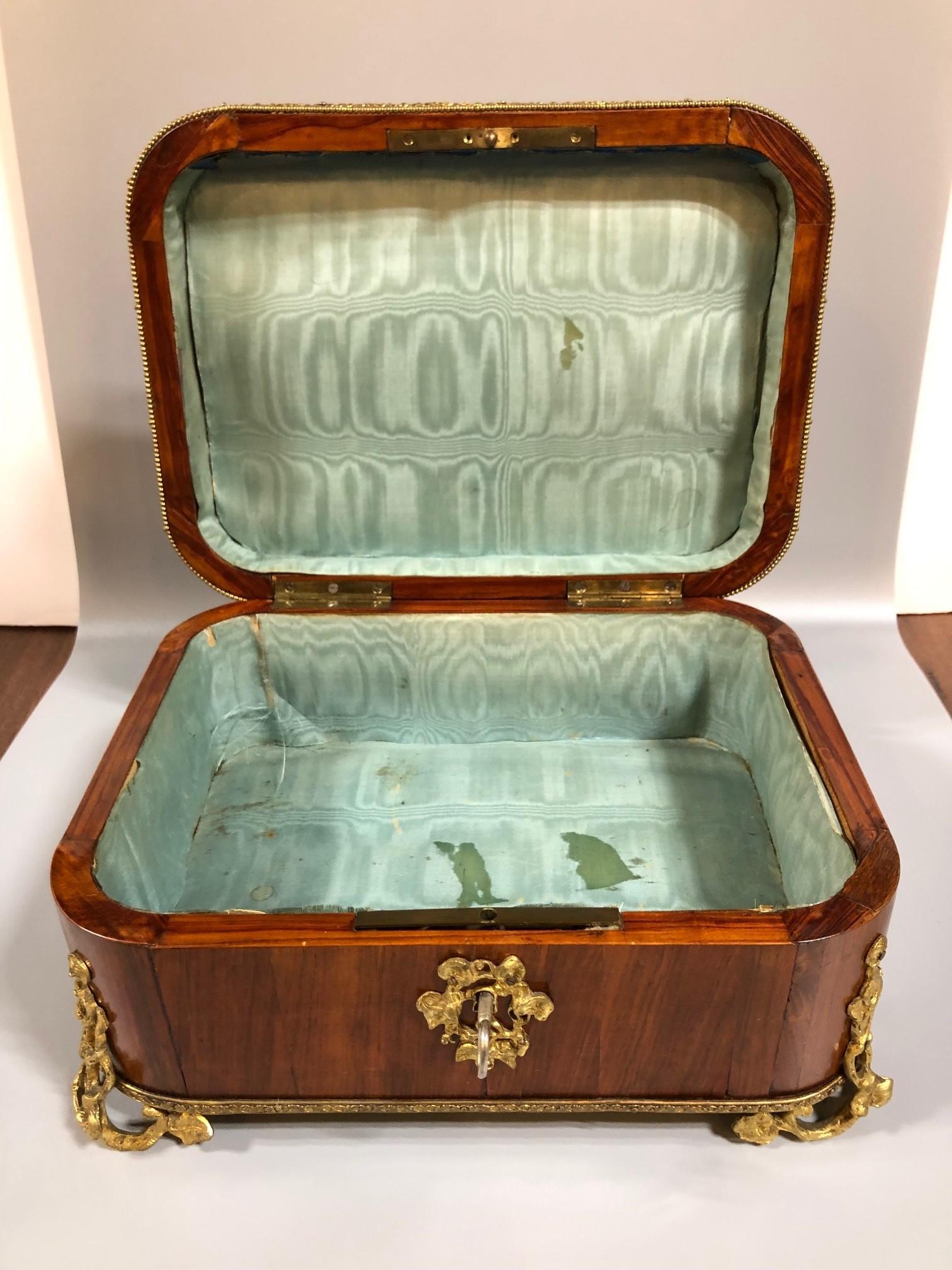 French 1880s Kings wood jewelry box also known as rosewood with beautiful bronze ormolu trim and feet. Kingwood considered a true rosewood and probably the strongest of all the rosewoods. The history of kingwood supposedly got its name from several