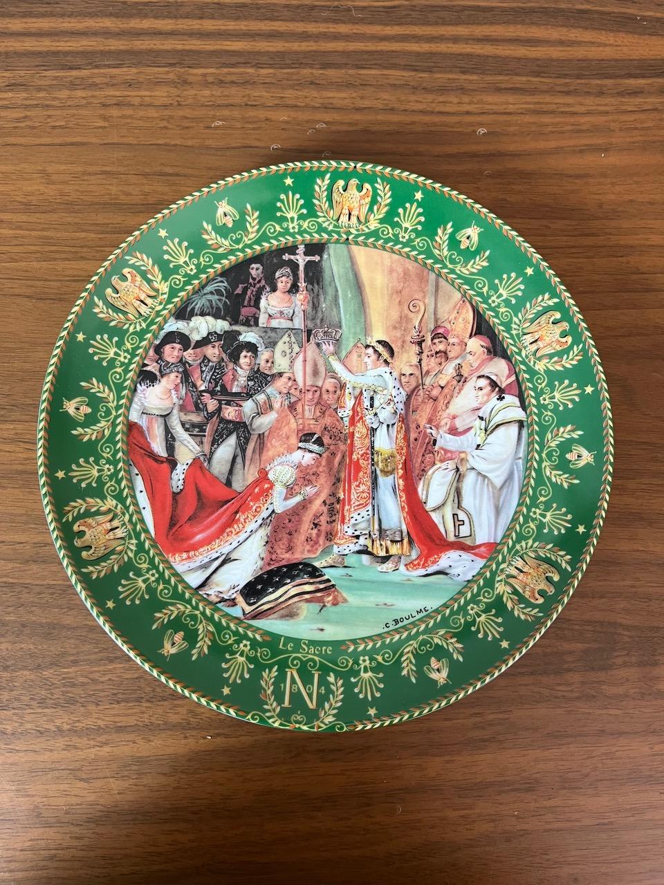 Set of three decorative Limoges porcelain plates, limited edition (see photos). These plates by Claude Boulmé depict detailed and colorful scenes from the Napoleonic era. Each plate is framed with a wide green border adorned with delicate motifs,
