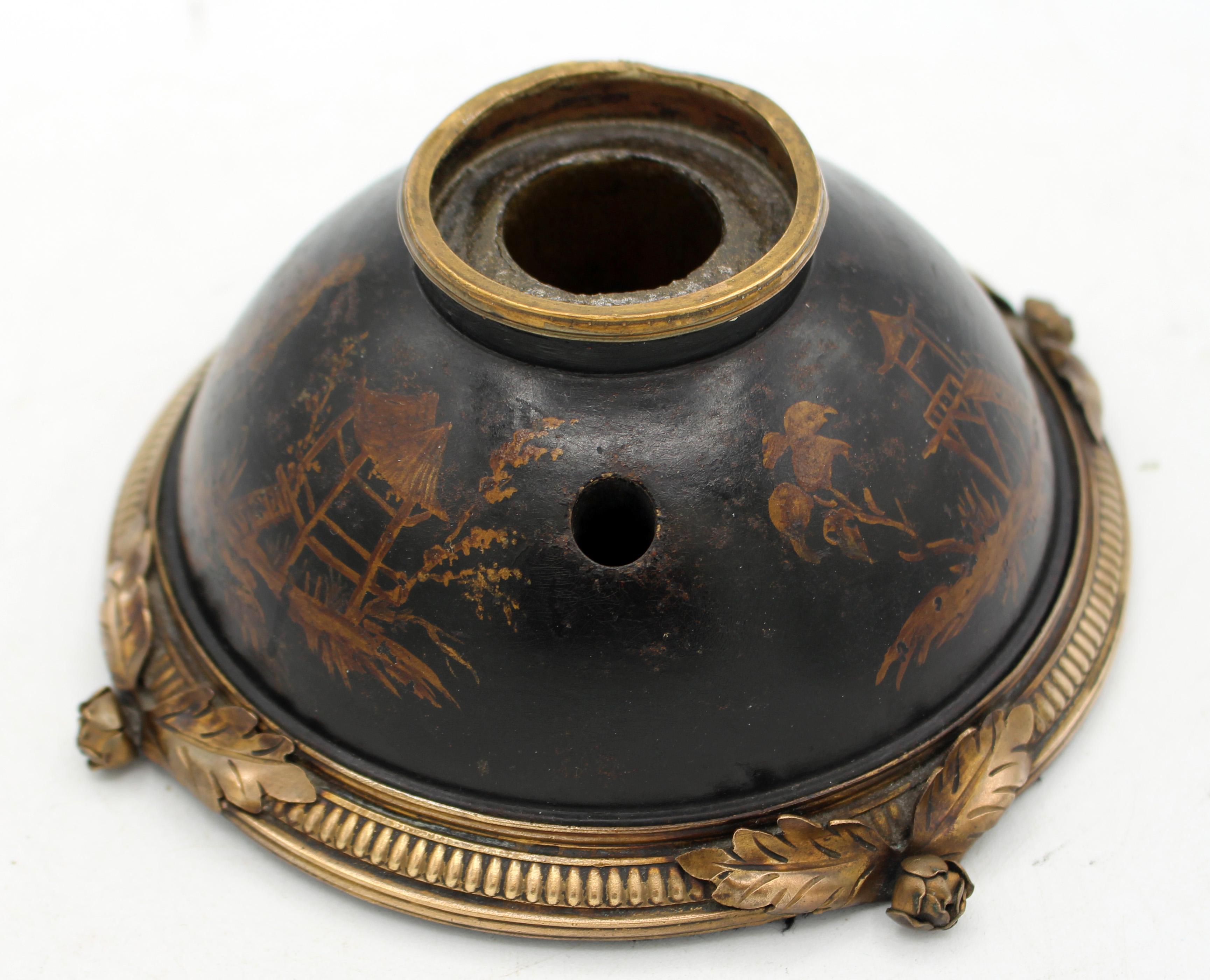 Late 19th century French treen inkwell with pen holder. Elegantly decorated with subtly colored chinoiserie scenes of gardens & bamboo follies. Brass trim with floral & leaf feet. Base newly baized in black. Lacks ink insert, however it is metal