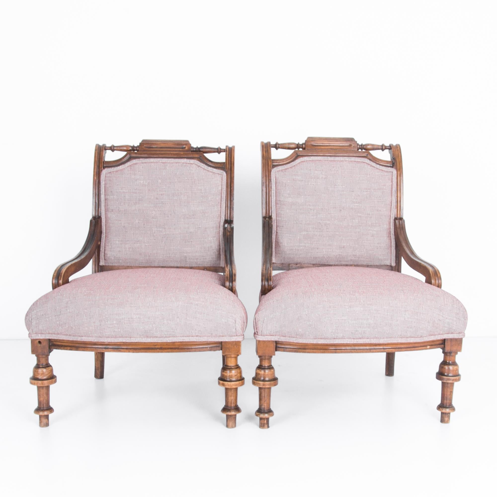 From France, circa 1880. Eye-catching decorative wood turned columns give a great detail in these Provincial armchairs. The chairs are composed with classical curves, following the rigour of geometric proportion and the orders of French design,