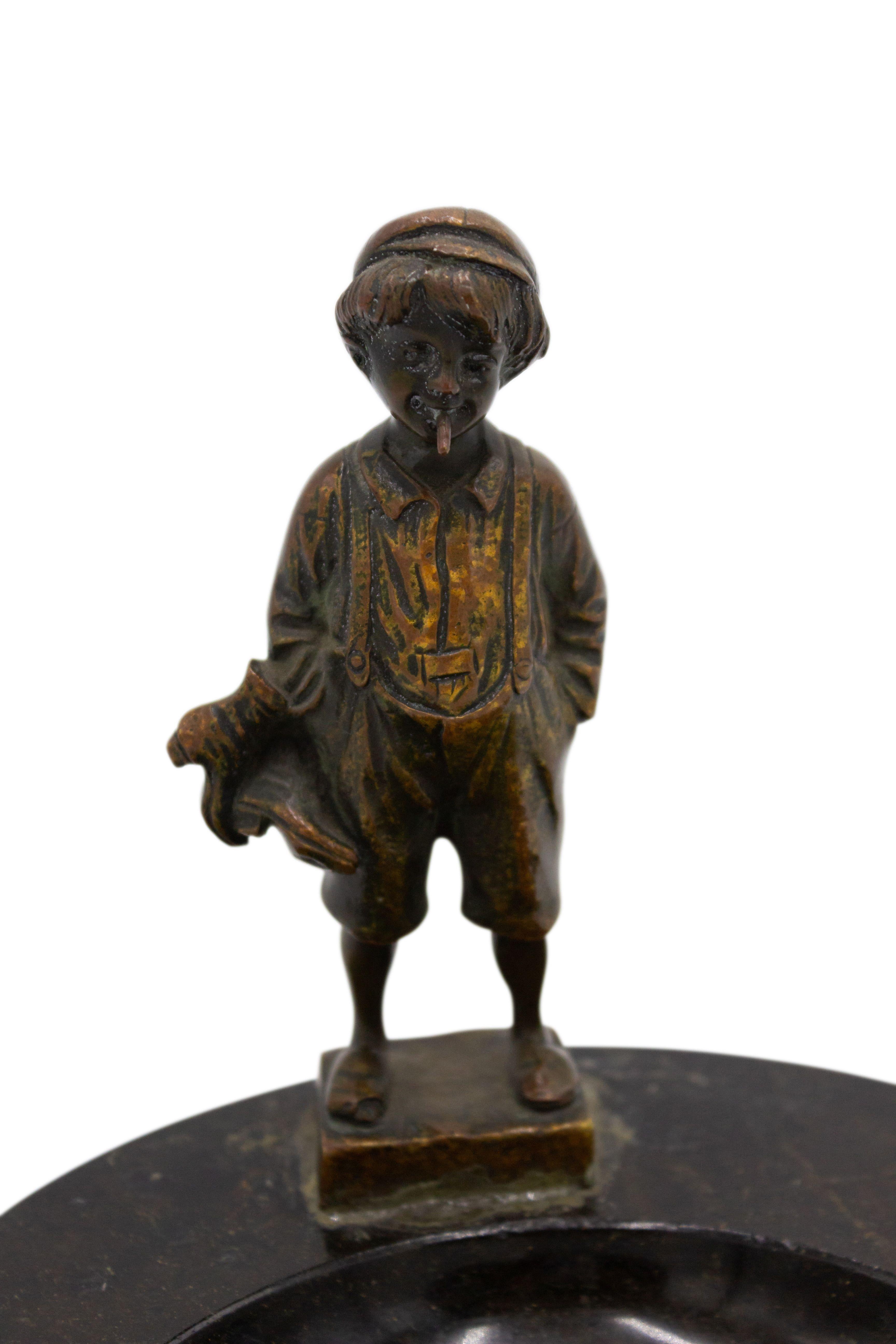 French Victorian round black marble ashtray with mounted figural bronze of a young boy.