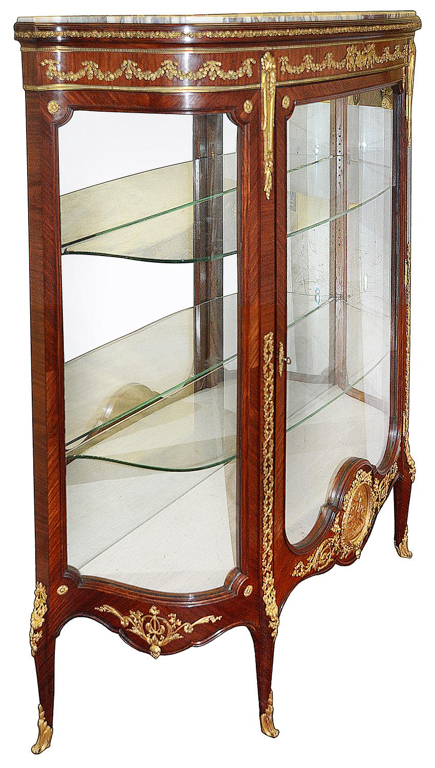 A fine quality late 19th century French Louis XVI style mahogany vitrine, having wonderfully fine quality gilded ormolu mounts. Having its original marble top, the single glazed door opening to reveal adjustable glass shelves within. A classical