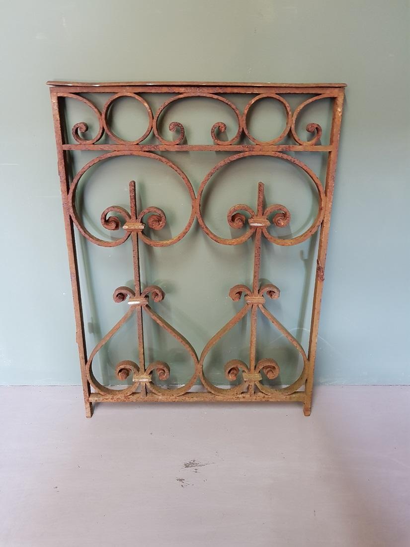 Antique French wrought iron and heavy garden door with curls and bars, and it has obtained a beautiful patina, late 19th century. 

The measurements are,
Depth 3 cm/ 1.1 inch.
Width 62.5 cm/ 24.6 inch.
Height 86 cm/ 33.8 inch.
