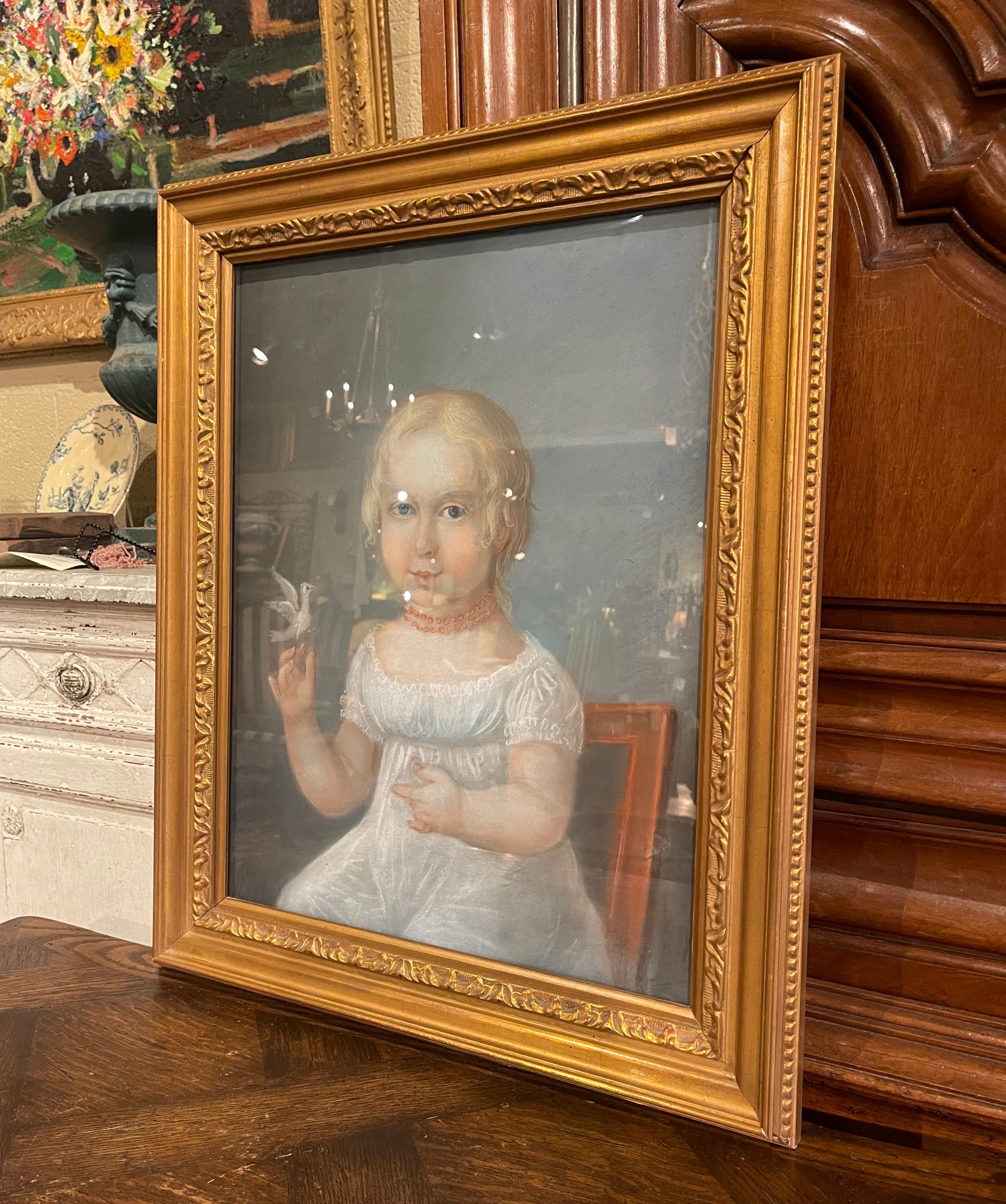 Decorate a study, bedroom, or living space with this beautiful antique pastel masterpiece. Created in France circa 1880, the artwork depicts a young blonde girl sitting in a chair seemingly gazing at the painter, dressed in a 19th-century white