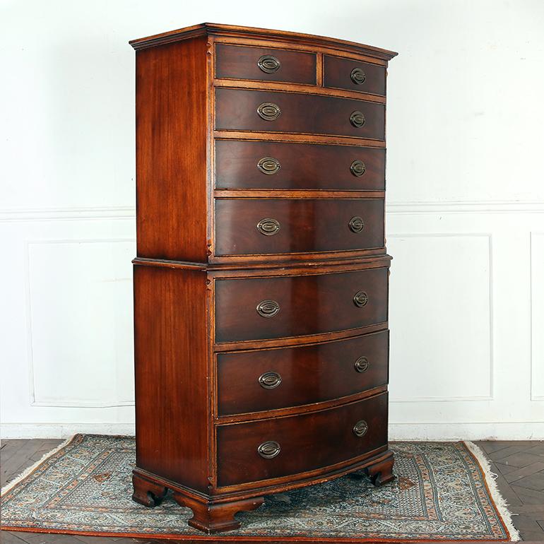 This handsome piece is made of flamed mahogany with inlaid boxwood and dressed with its original, having eight drawers dressed in Georgian style brass hardware, with a lovely curved bow front. Late 19th century.