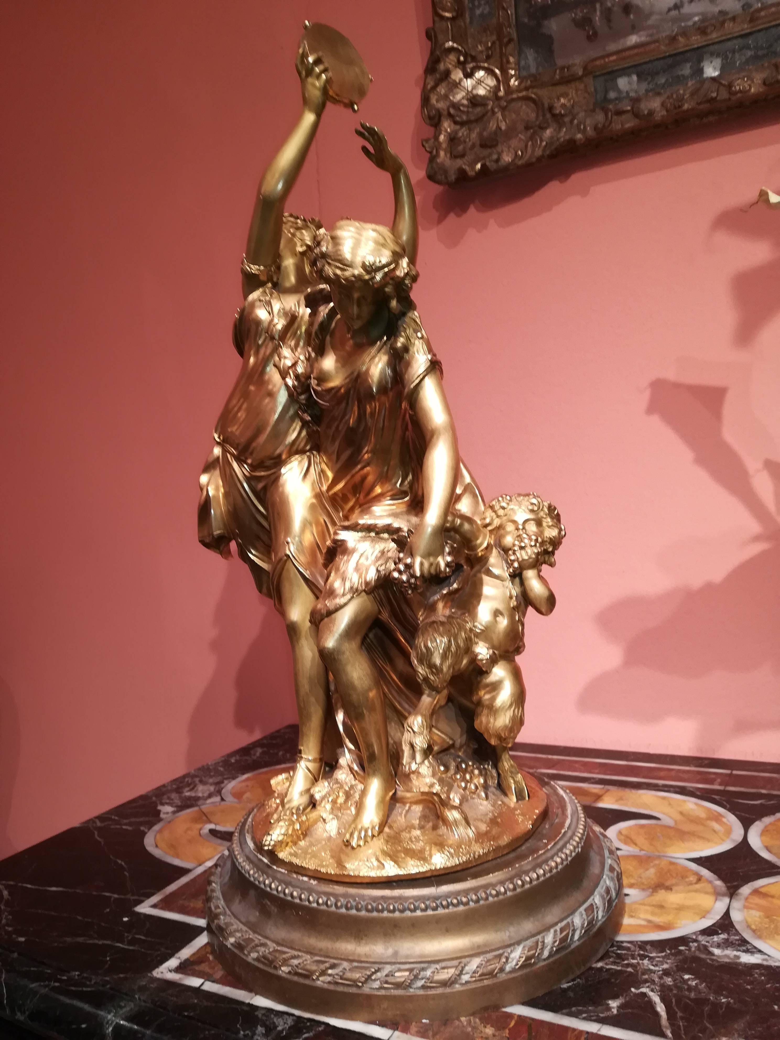 Late 19th century gilded bronze group after Clodion, gold patina, figurating three characters: 