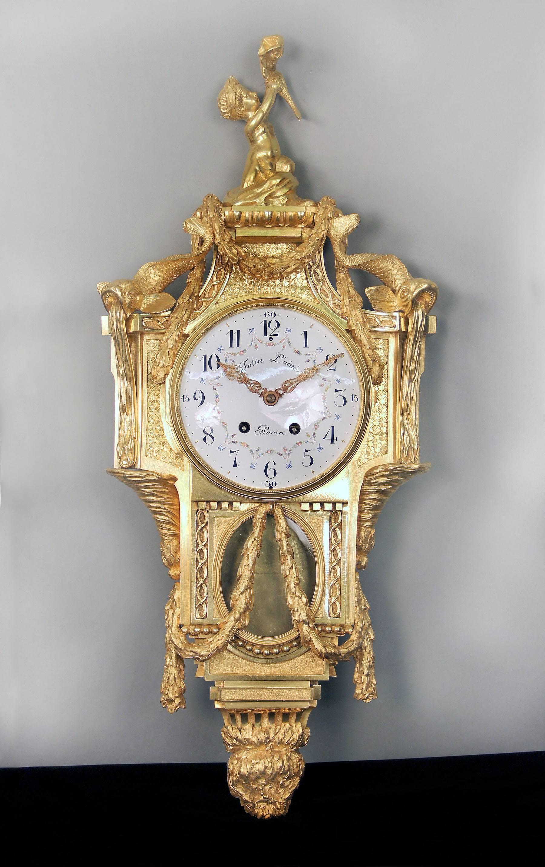 An exceptional late 19th century gilt bronze Cartel clock and companion barometer

By Henry Vian after Jean-Charles Delafosse

The tops with a putti holding a fish above garlands, two dolphins sit on each corner and the base designed with more