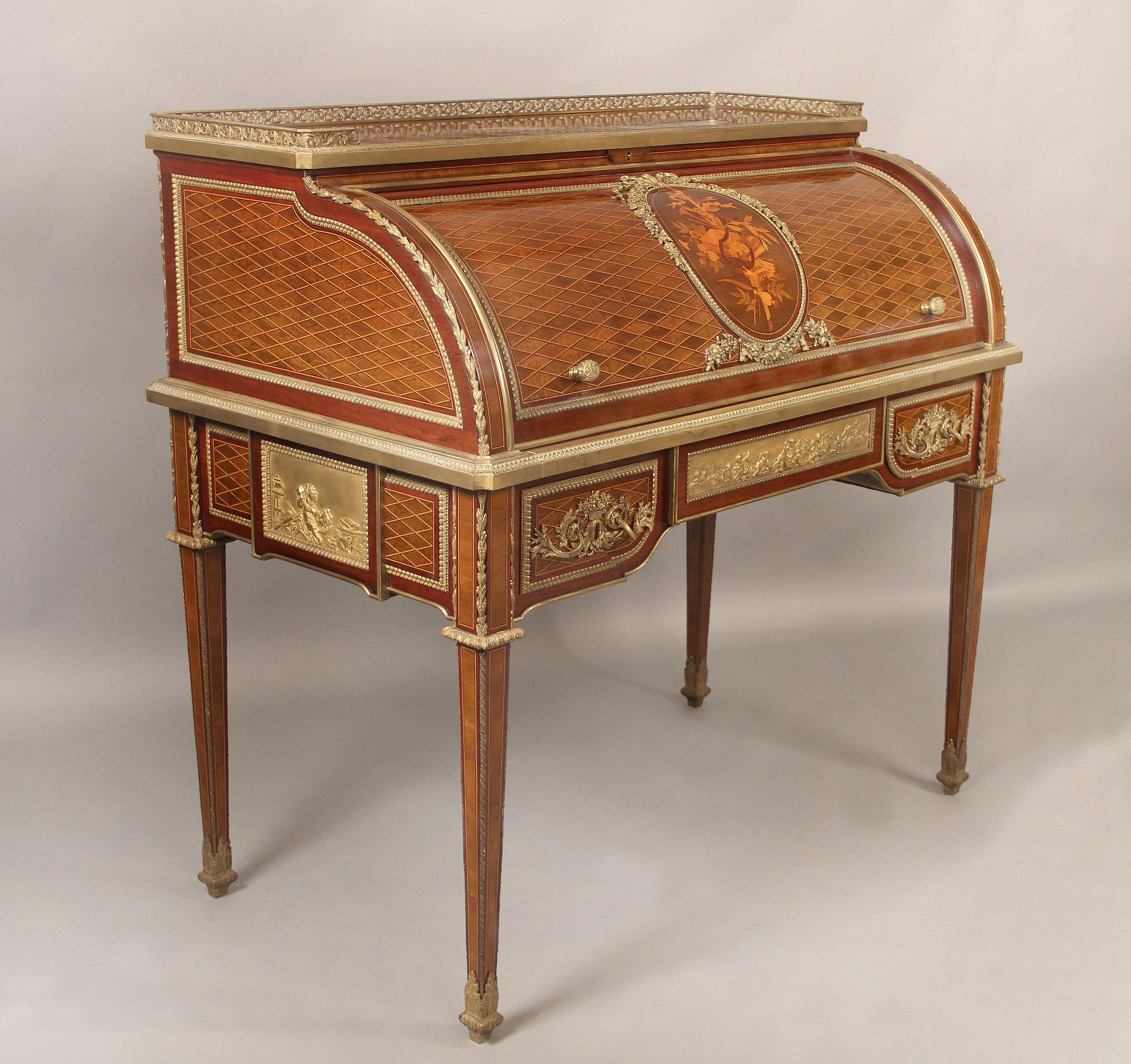 An excellent quality late 19th century gilt bronze mounted marquetry and parquetry bureau a cylinder by François Linke

François Linke – Index no. 100

The rectangular galleried top inlaid with lozenge parquetry, above a cylinder roll-top
