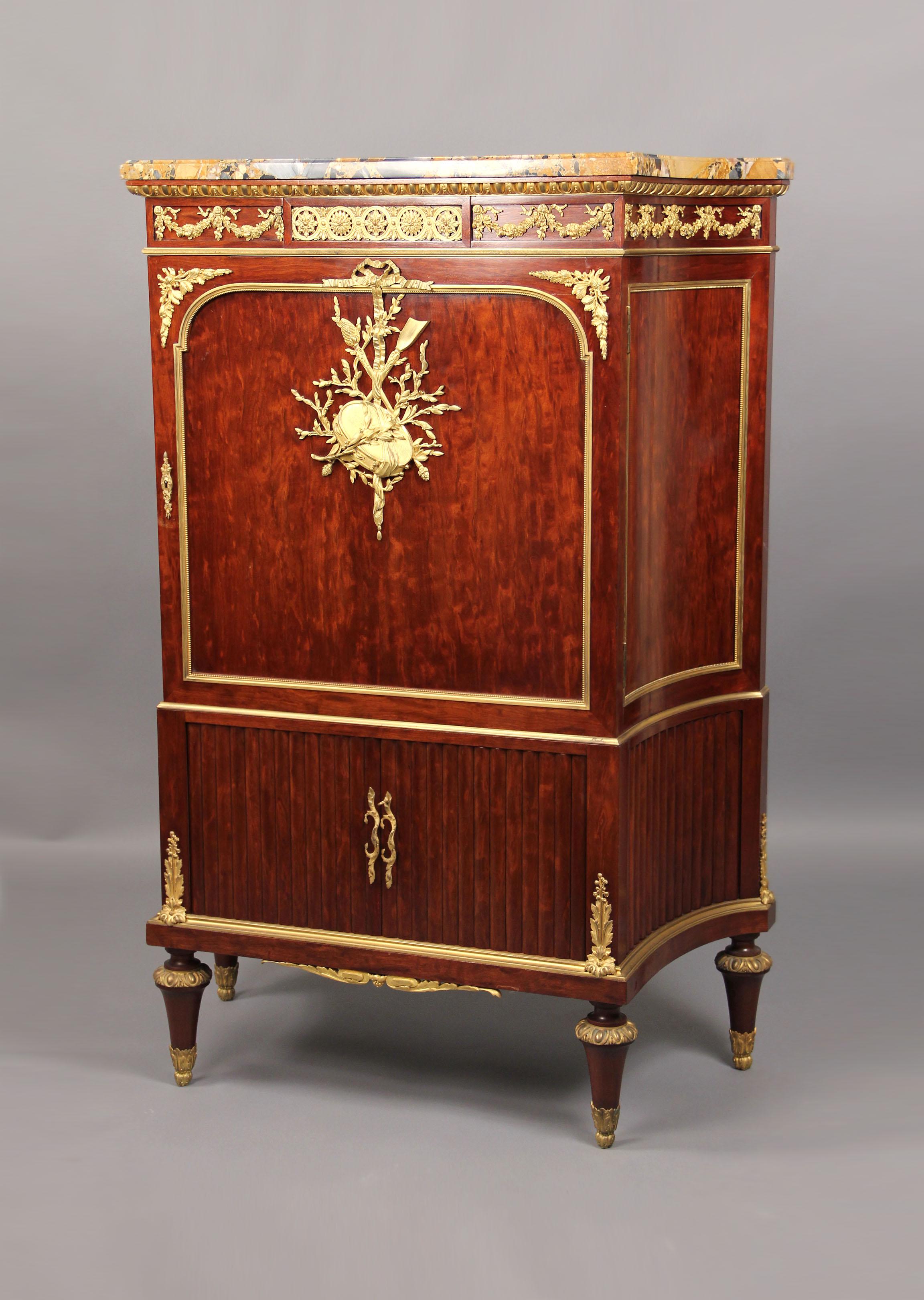 A Late 19th Century Louis XVI Style Gilt Bronze Mounted Mahogany Cabinet By François Linke

François Linke – Index no. 1108

Surmounted with a Brèche d’ Alep marble top, above a frieze with scrolling ribbon-tied swags, the upper cupboard door