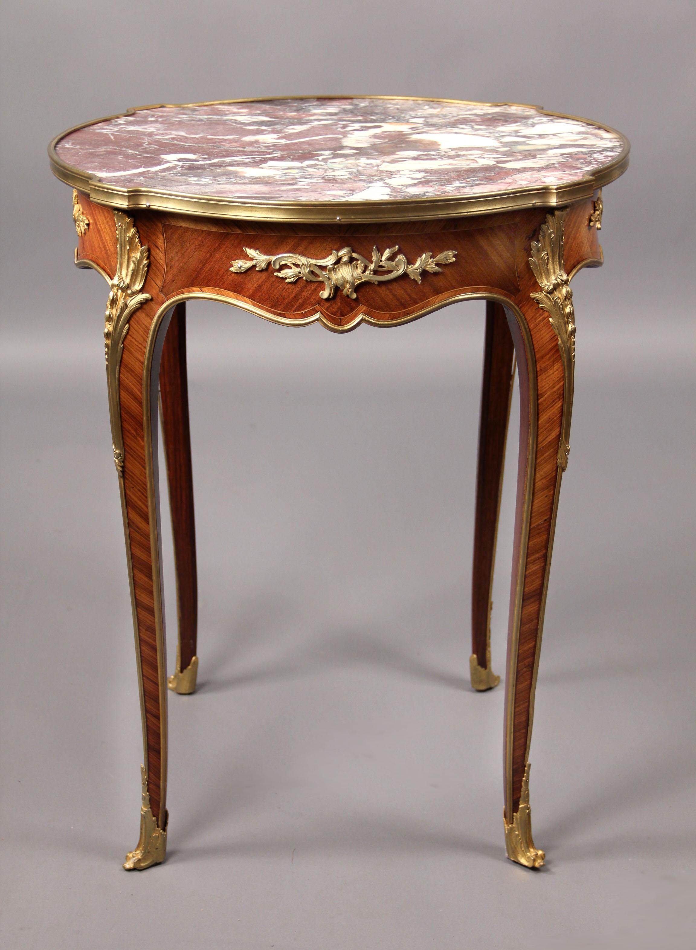 A Late 19th Century Louis XV Style Gilt Bronze Mounted Marble Top Lamp Table


The shaped circular Breche Violette marble insert top, above a bronze mounted frieze, on tapering bronze mounted legs and scrolled acanthus sabots.

Details:
Height – 30