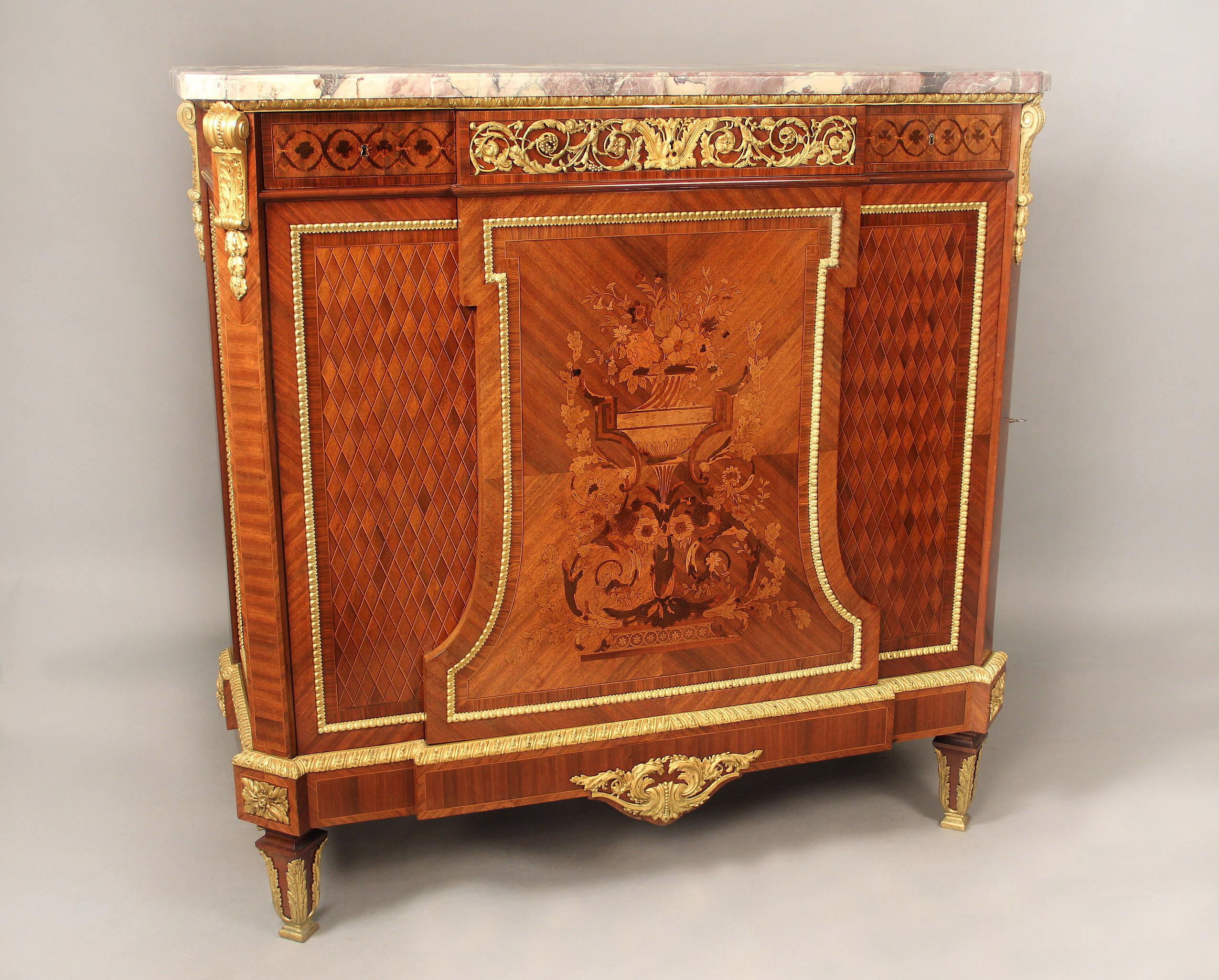A Wonderful Late 19th Century Louis XVI Style Gilt Bronze Mounted Marquetry and Parquetry Cabinet by Maison Forest, Paris

Maison Forest

The breche violette marble top above a center frieze drawer designed with bronze mounts of flowers and berries,