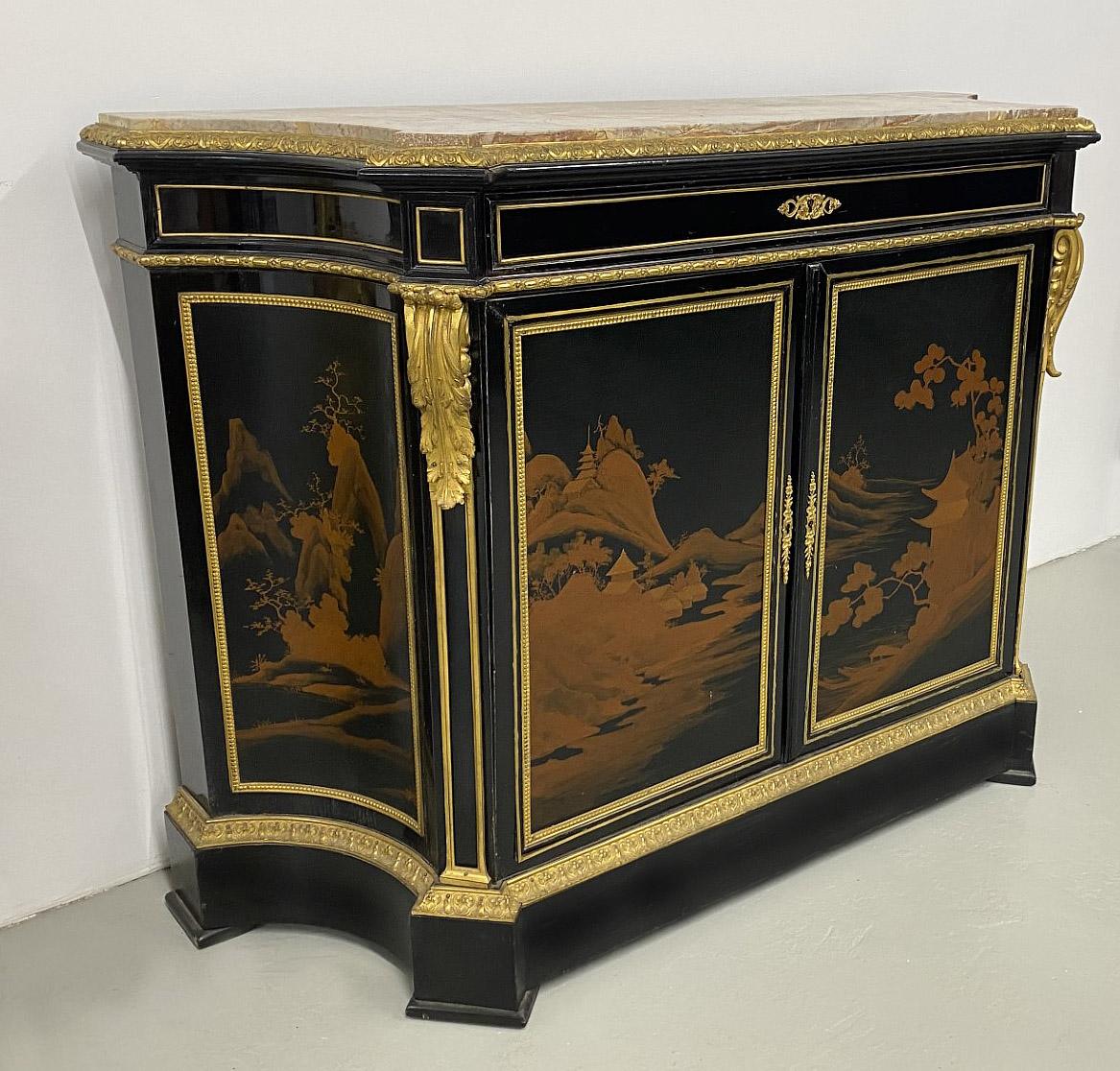 A Late 19th Century Gilt Bronze Mounted Transitional Style Lacquer Cabinet

Marble top above a bronze mounted drawer, with a double door with lacquered landscape scenes that opens for storage, the sides matching with similar decorated