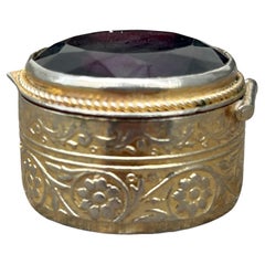 Late 19th Century Gilt Metal Pill Box with Beveled Burgundy Glass Top