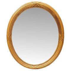 Miroir ovale en bois doré de la fin du XIXe siècle
